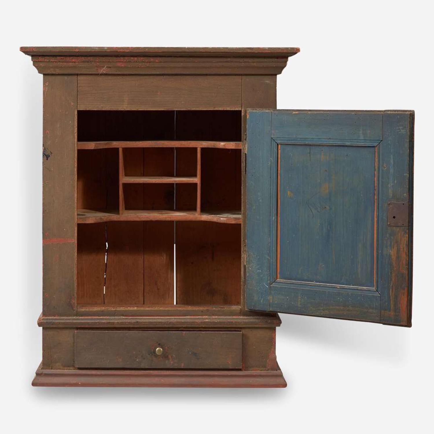 A green or brown painted pine wall cupboard late 18th century