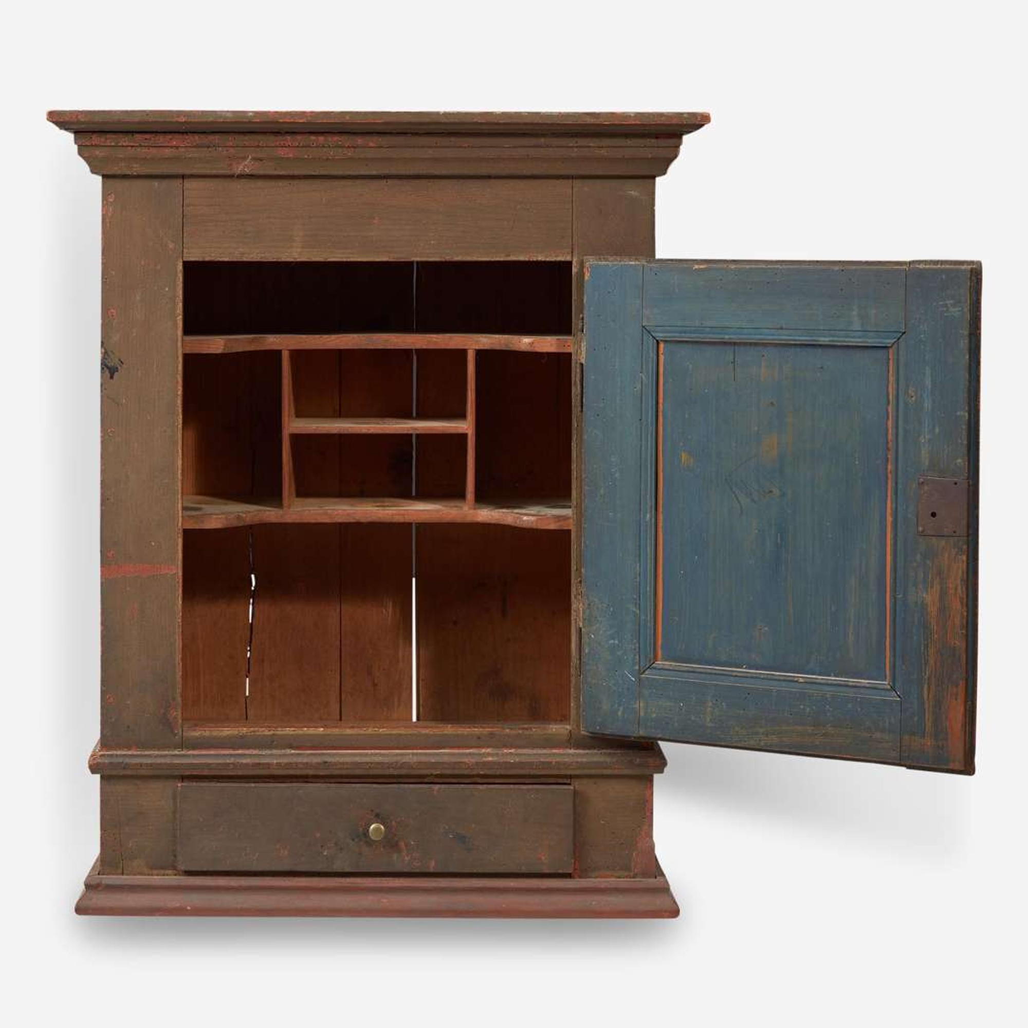 A green or brown painted pine wall cupboard late 18th century