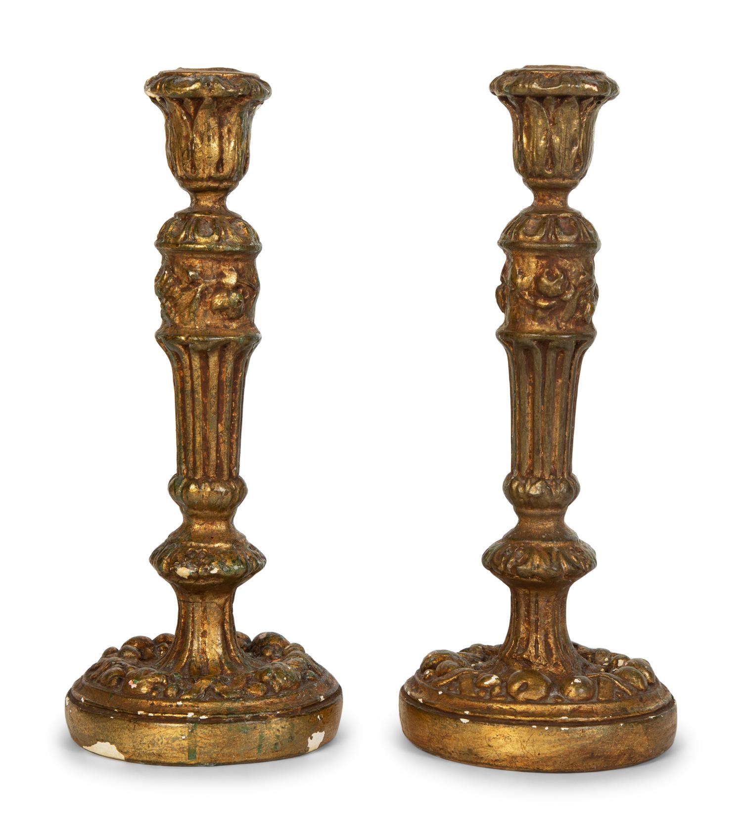 A Pair of Carved Giltwood Candlesticks