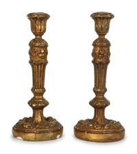 A Pair of Carved Giltwood Candlesticks