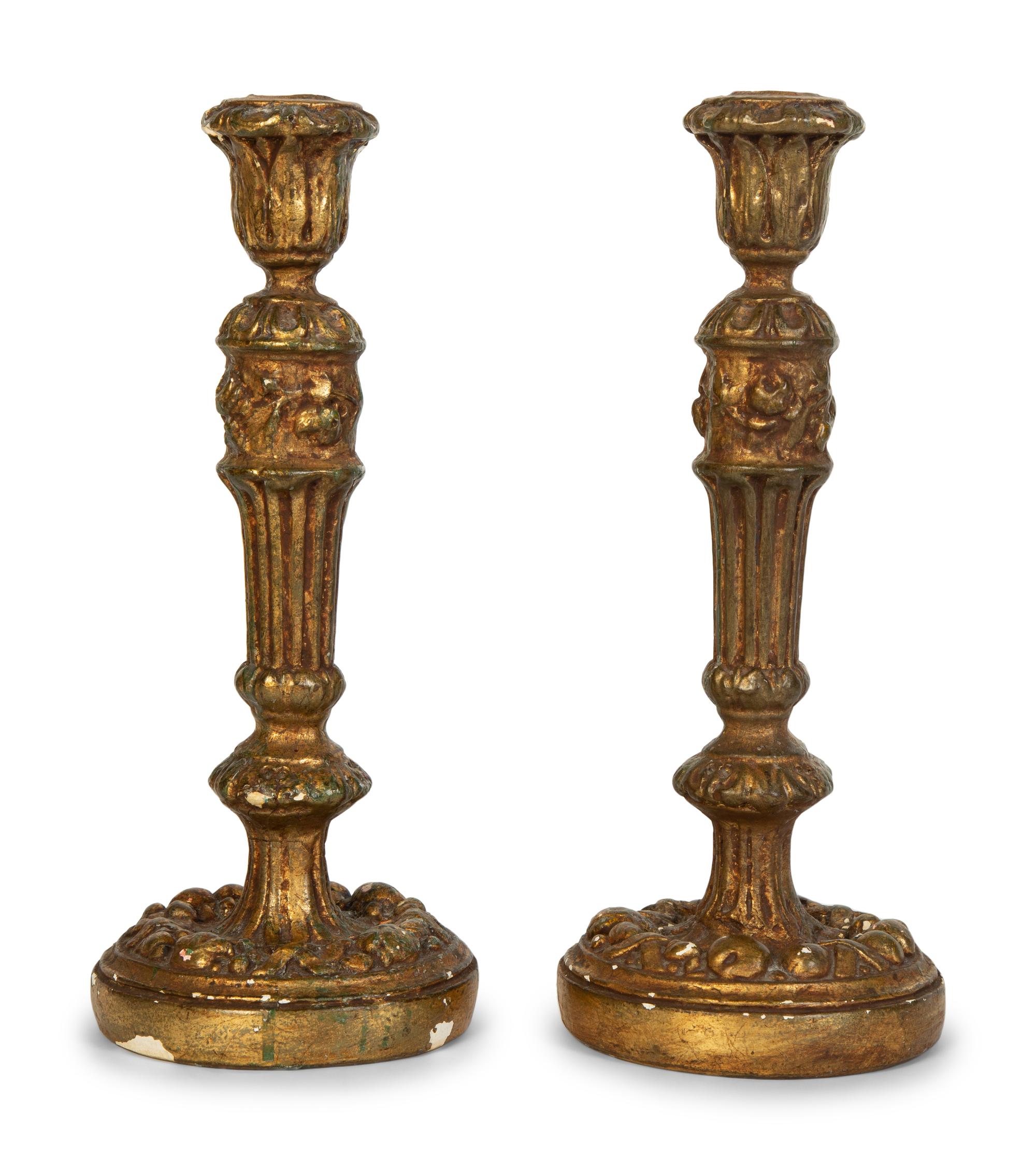 A Pair of Carved Giltwood Candlesticks