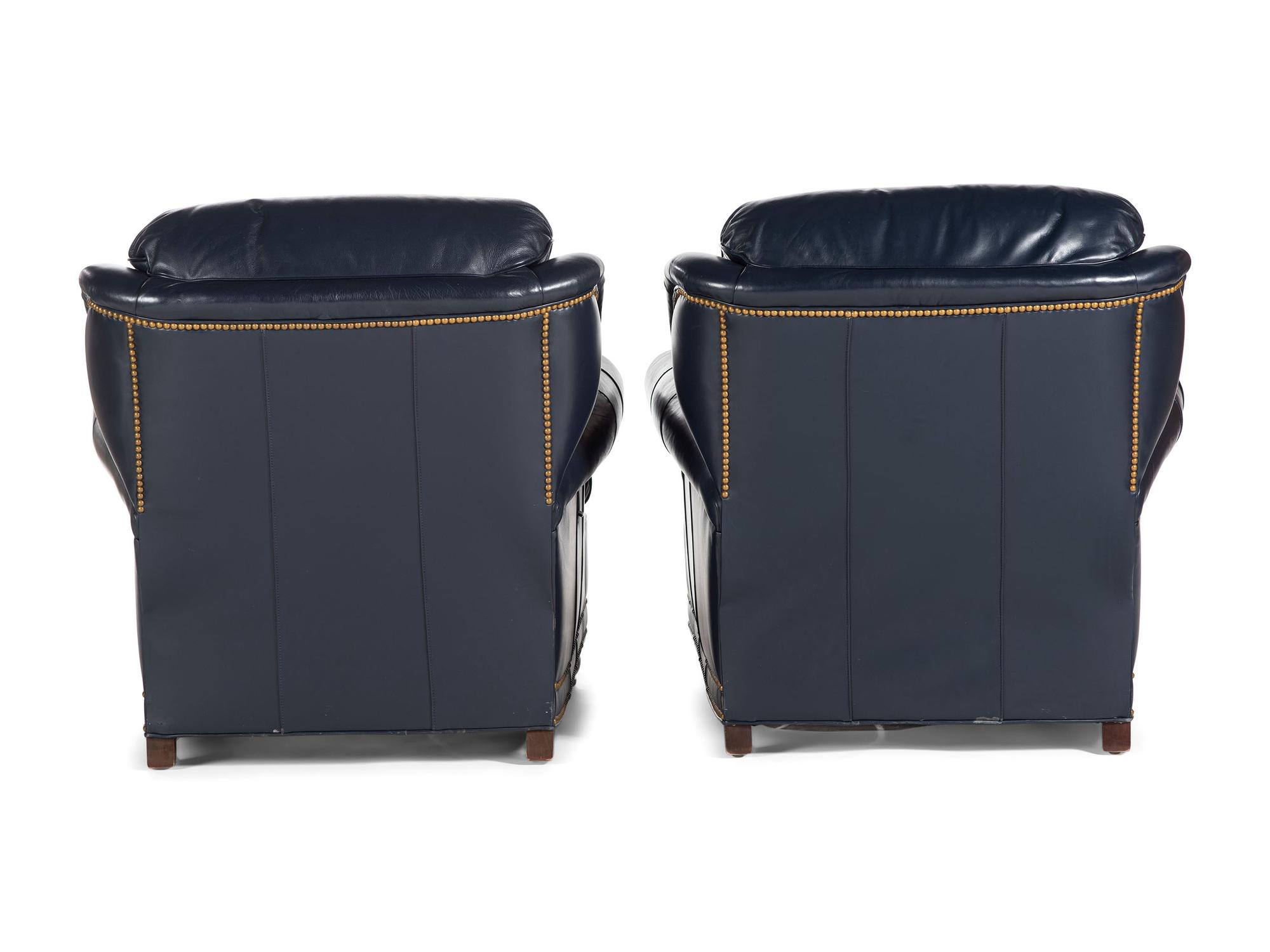 A Pair of Hancock and Moore Brass-Tacked Leather Chairs