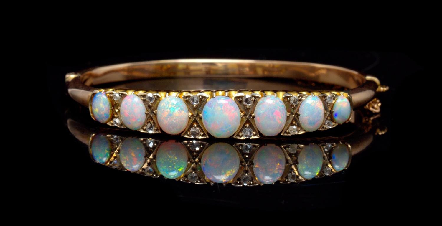 A Yellow Gold, Opal and Diamond Bangle Bracelet, 9.10 dwts.