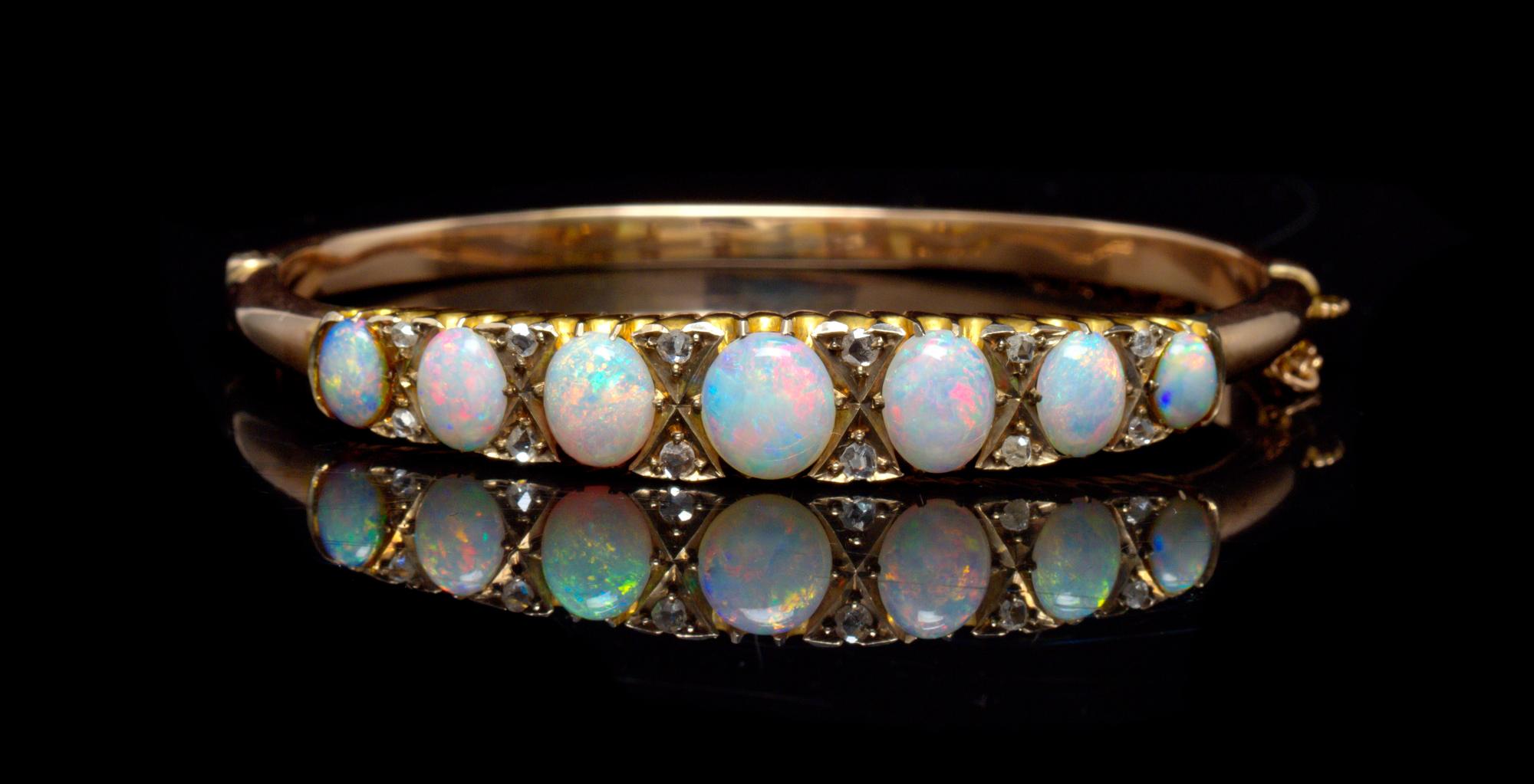A Yellow Gold, Opal and Diamond Bangle Bracelet, 9.10 dwts.