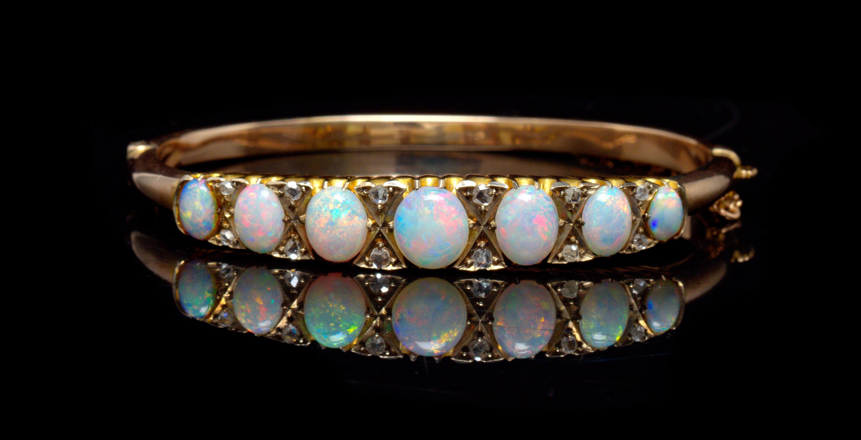 A Yellow Gold, Opal and Diamond Bangle Bracelet, 9.10 dwts.