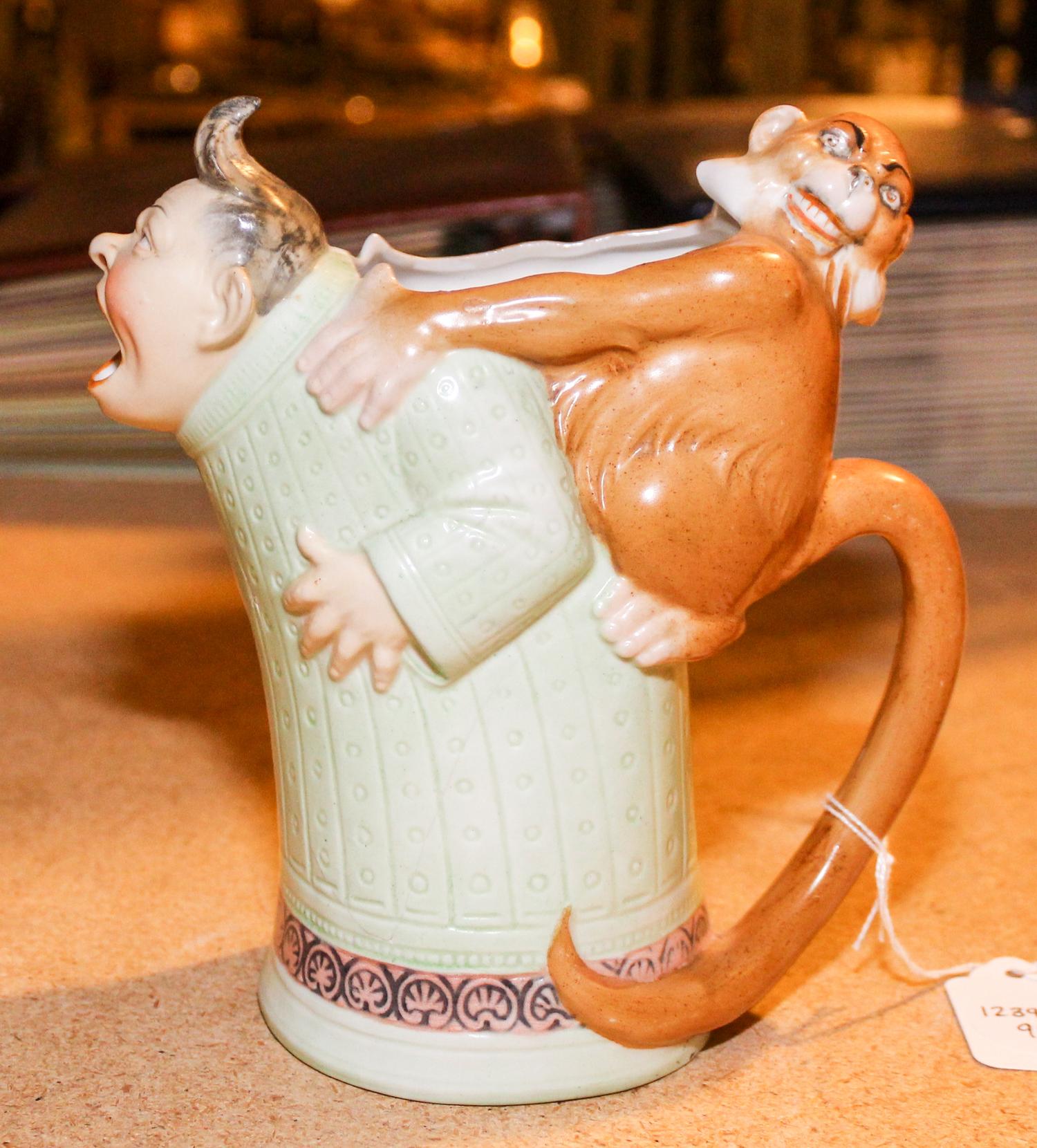 A Ceramic Figural Mug Height 6 1/2 inches.