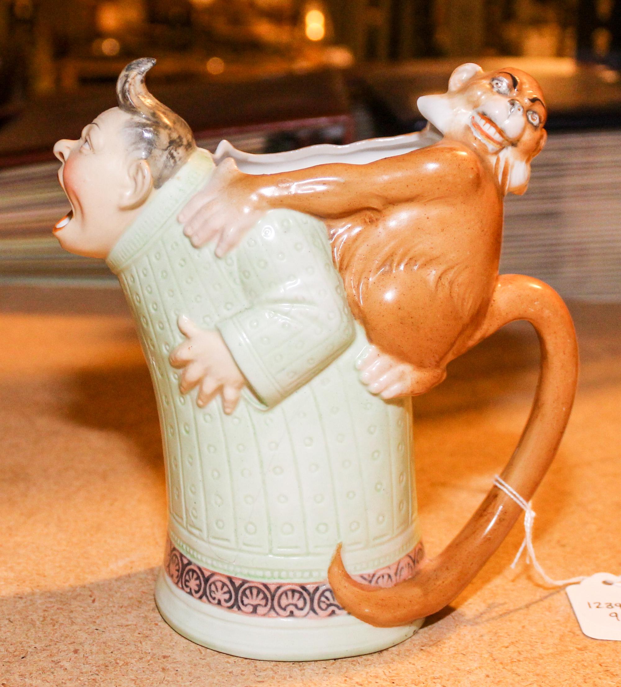 A Ceramic Figural Mug Height 6 1/2 inches.