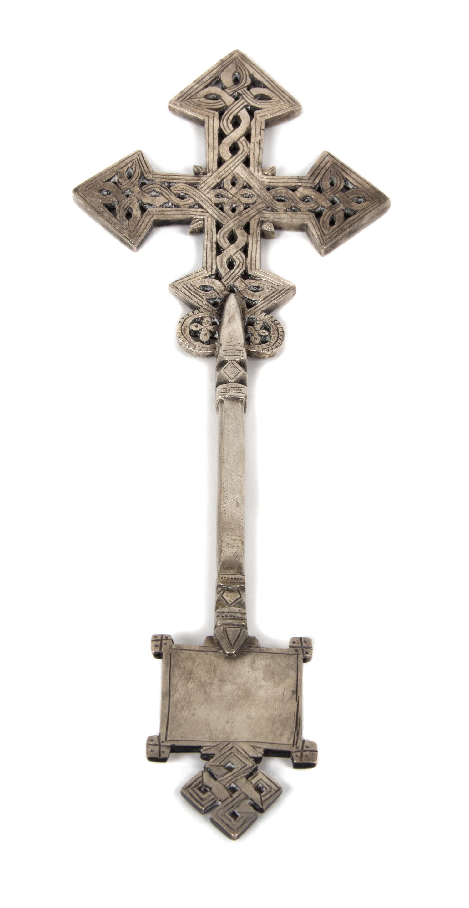 An Etched Silvered Metal Celtic Cross Desk Ornament Height 10 1/4 inches.