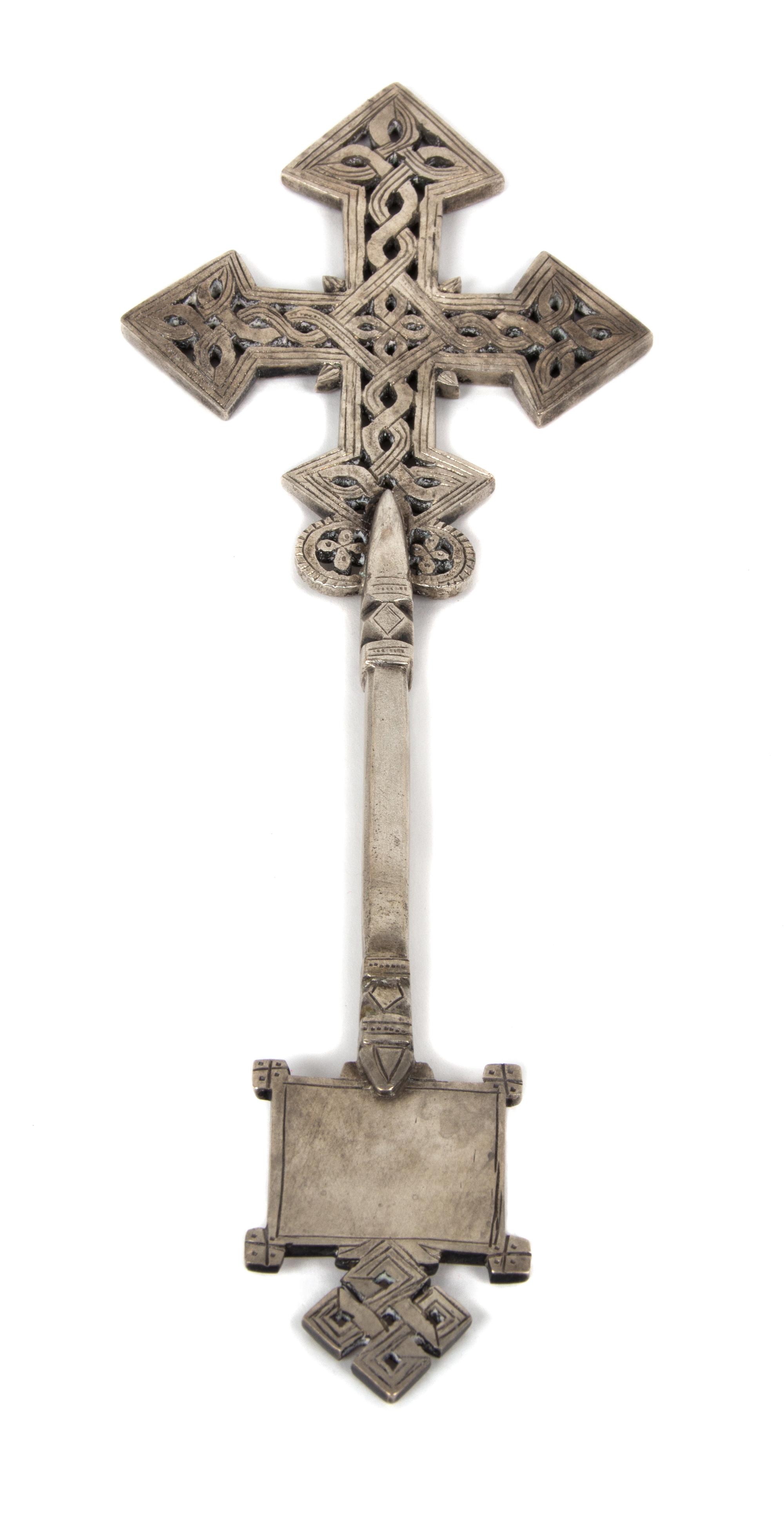 An Etched Silvered Metal Celtic Cross Desk Ornament Height 10 1/4 inches.