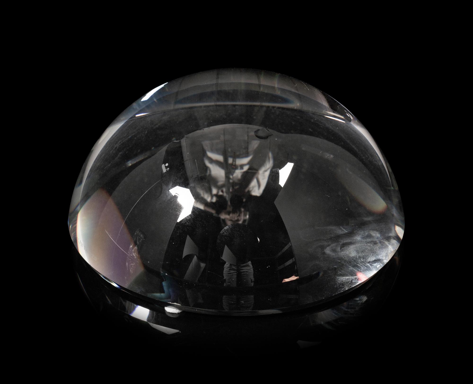 A Ralph Lauren Acrylic Clark Hourglass and a Glass Clayton Dome Paperweight
