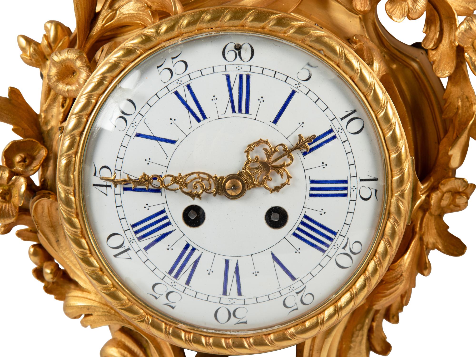 A Louis XV Style Gilt Bronze Cartel Clock and Barometer