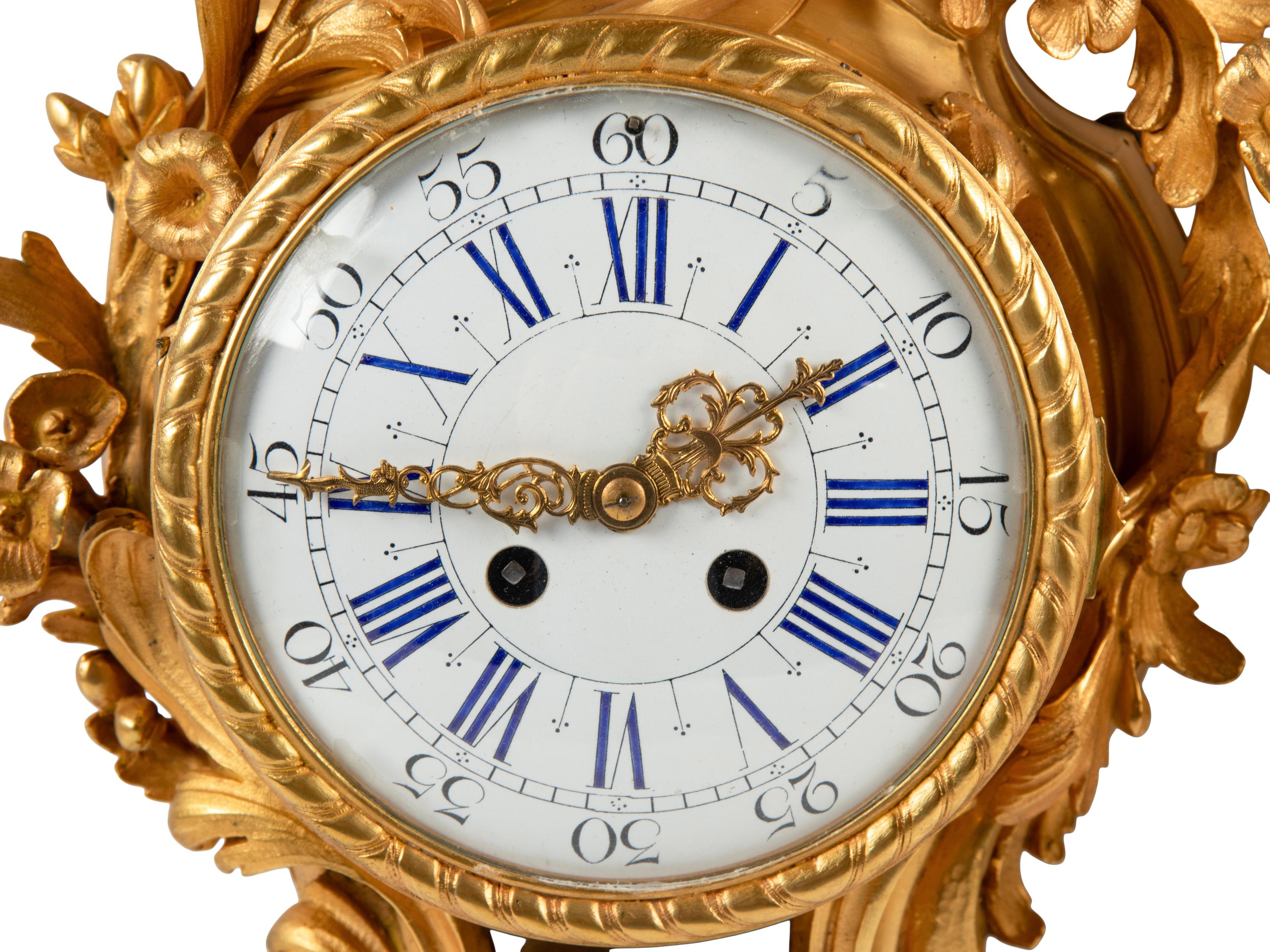 A Louis XV Style Gilt Bronze Cartel Clock and Barometer
