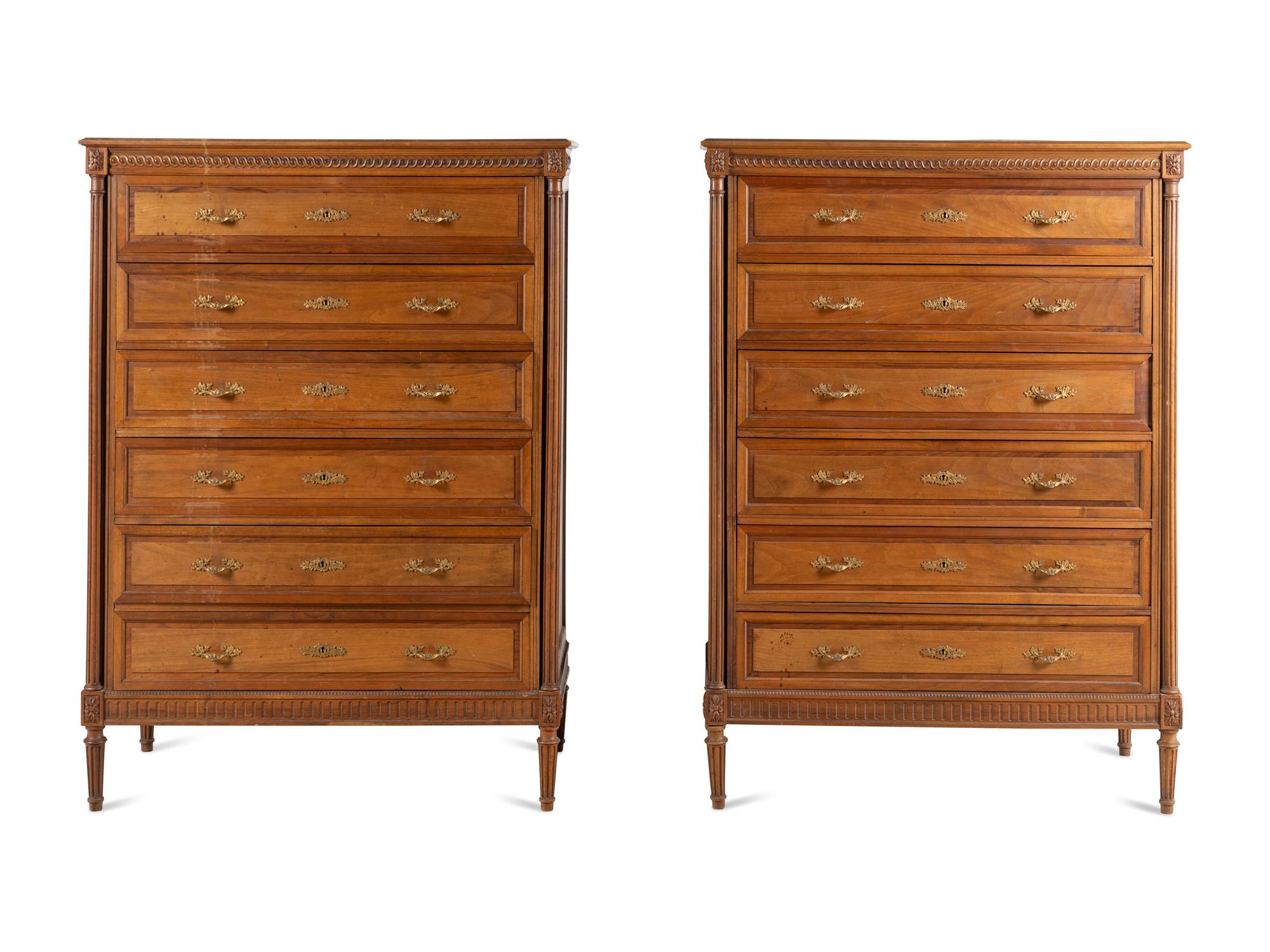 A Pair of Louis XVI Style Walnut Chests-of-Drawers