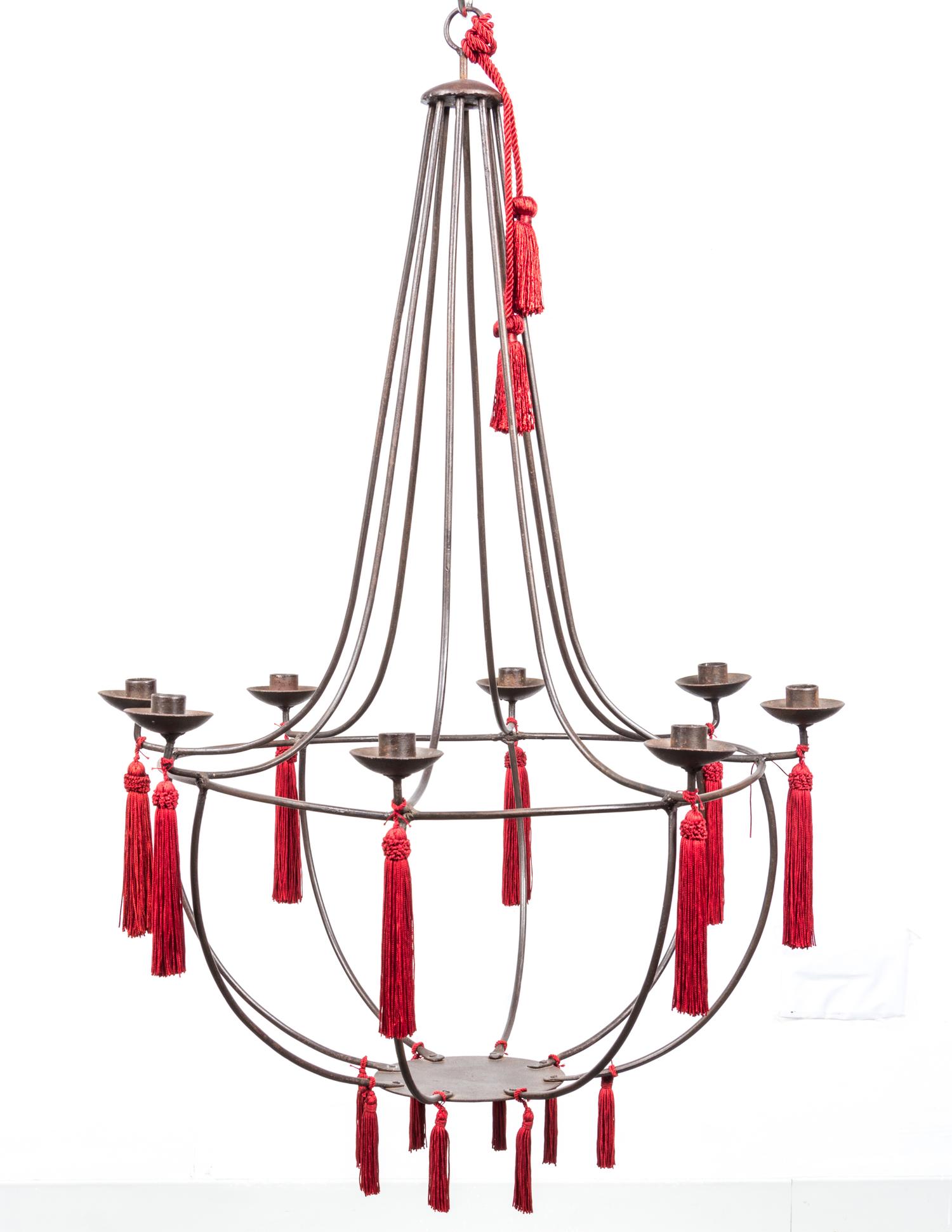 An Empire Style Iron Eight-Light Chandelier Height 32 1/2 x diameter 22 1/2 inches.