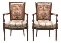 A Pair of Louis XVI Style Carved Fruitwood and Upholstered Fautueils Height 35 x width 22 x depth 18 inches. — 19TH CENTURY