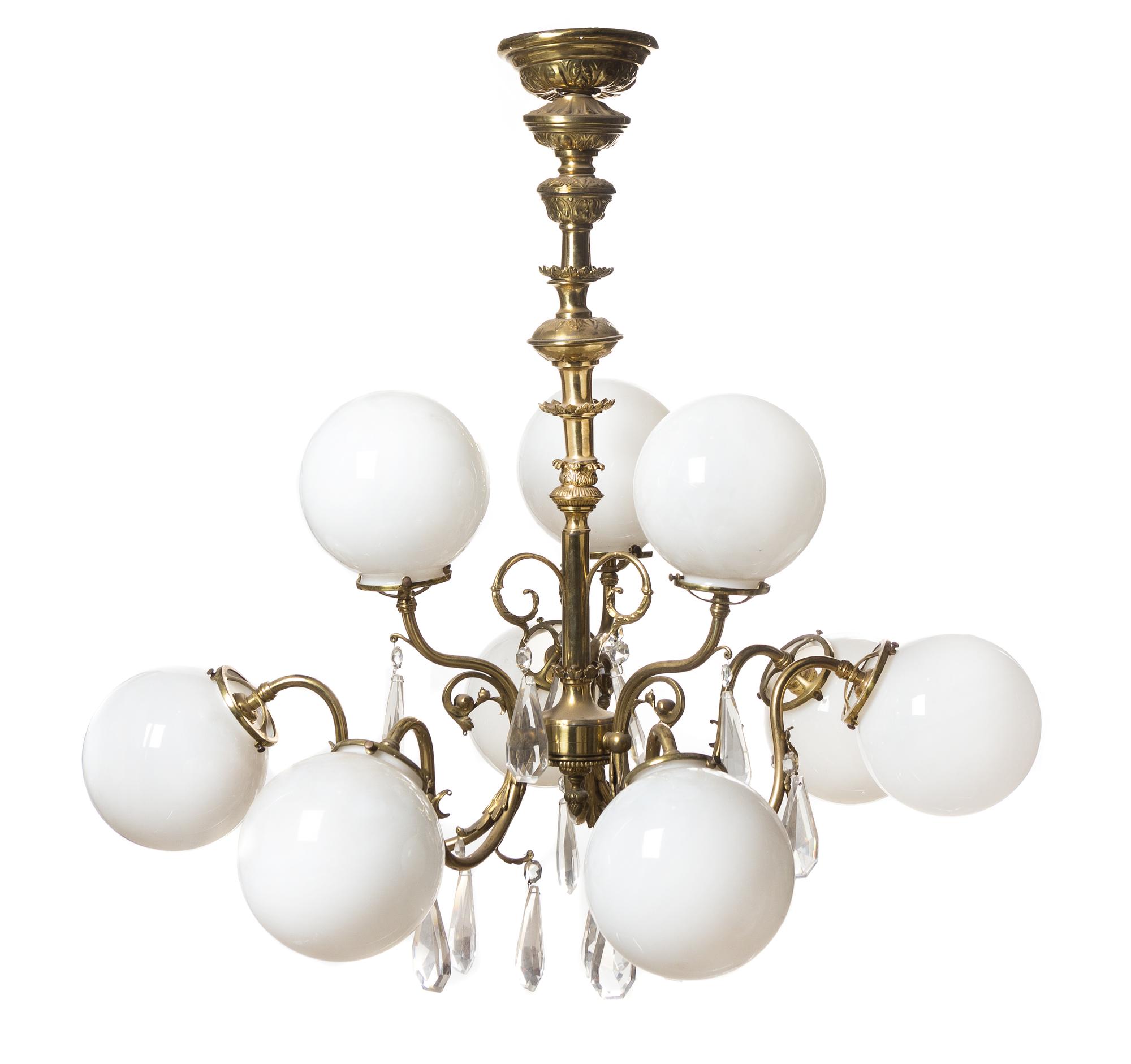 A Neoclassical Gilt Brass Nine-Light Chandelier, Height 35 x diameter 36 inches.