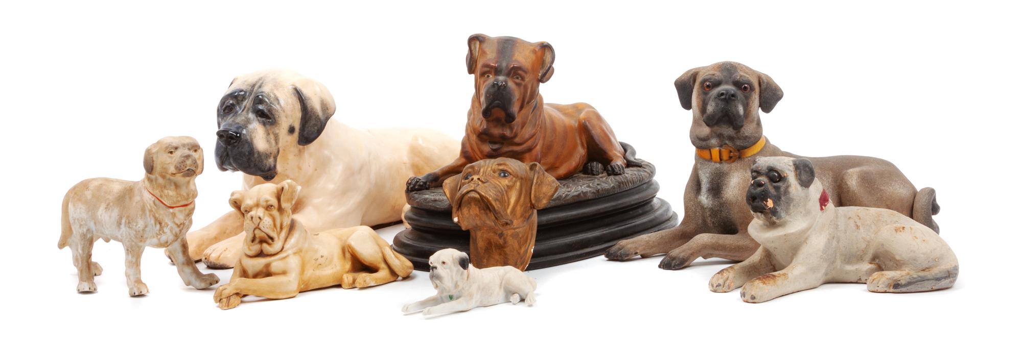A Group of Eight Mastiff Figures Width of widest 14 1/2 inches.