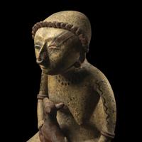 A Nayarit Terracotta Seated Figure with Dog