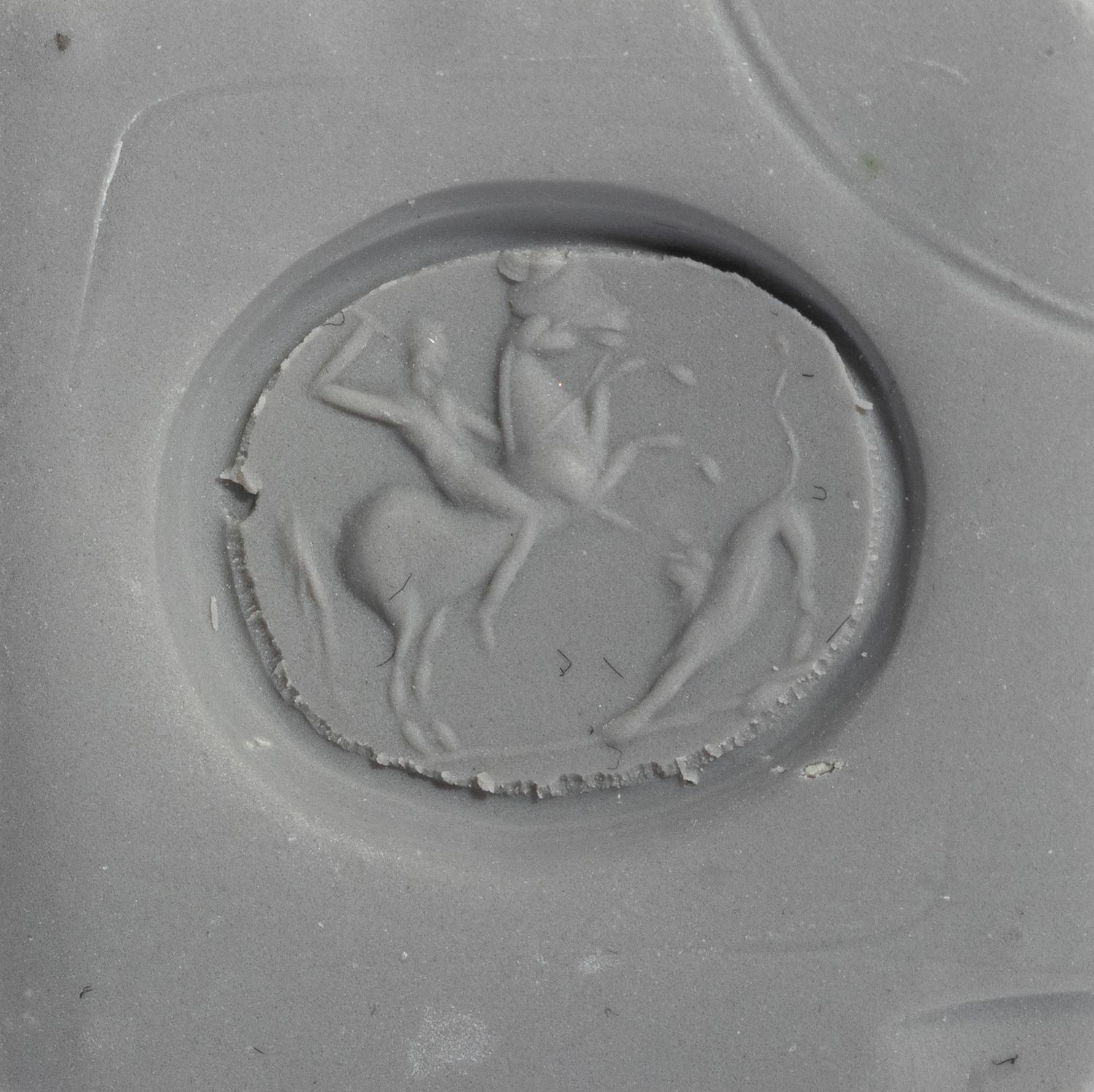 A Late Roman Agate Ring Stone with a Hunting Scene — Set in a gold band