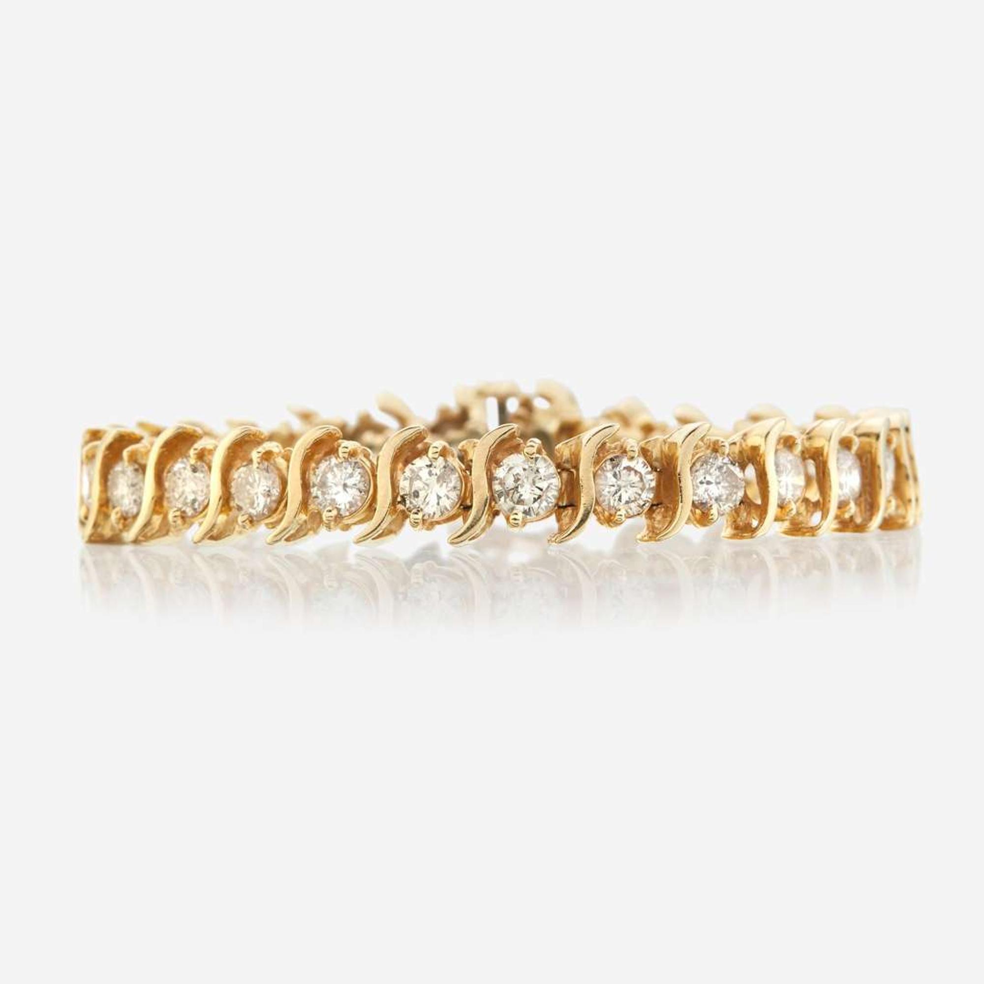 A gold and diamond bracelet