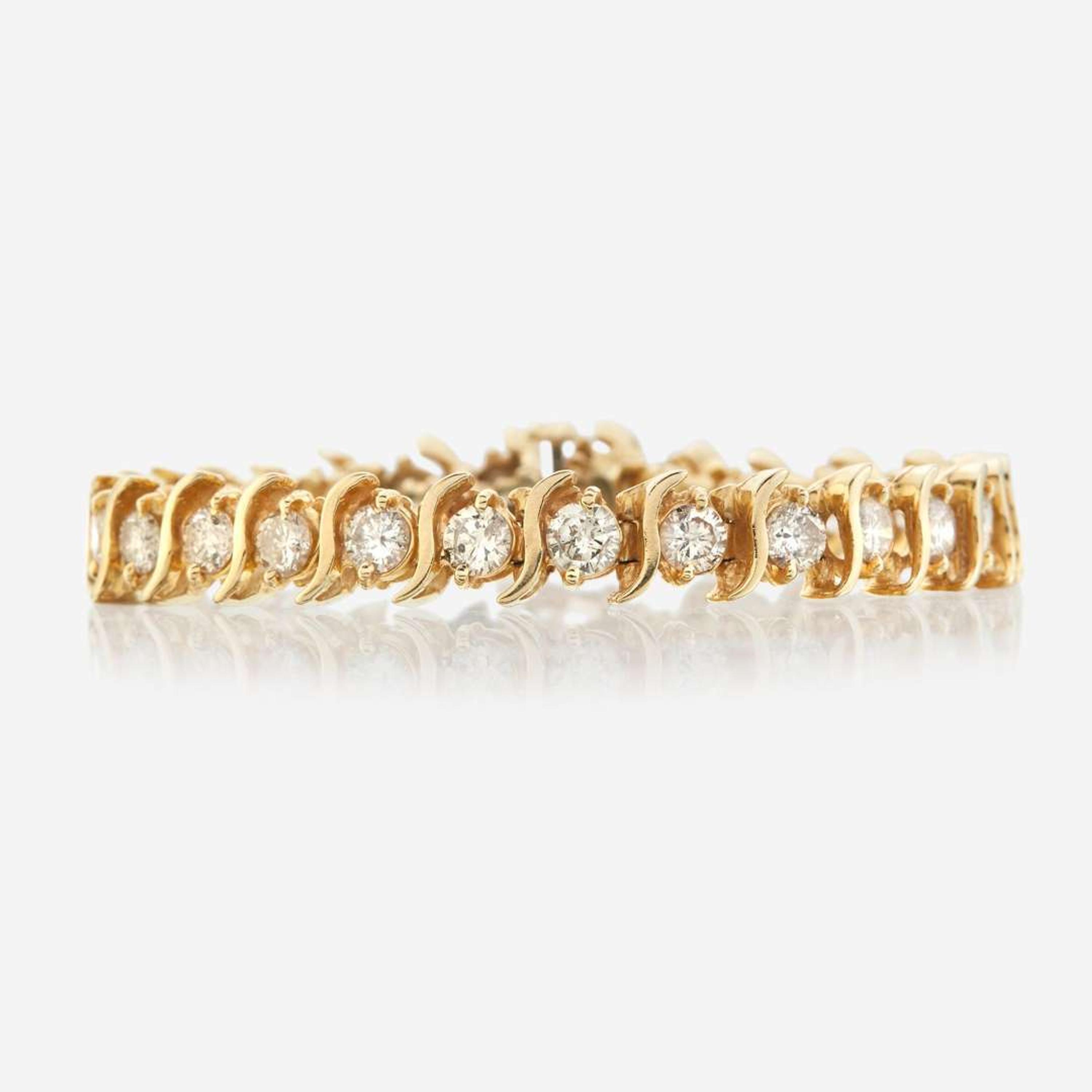 A gold and diamond bracelet