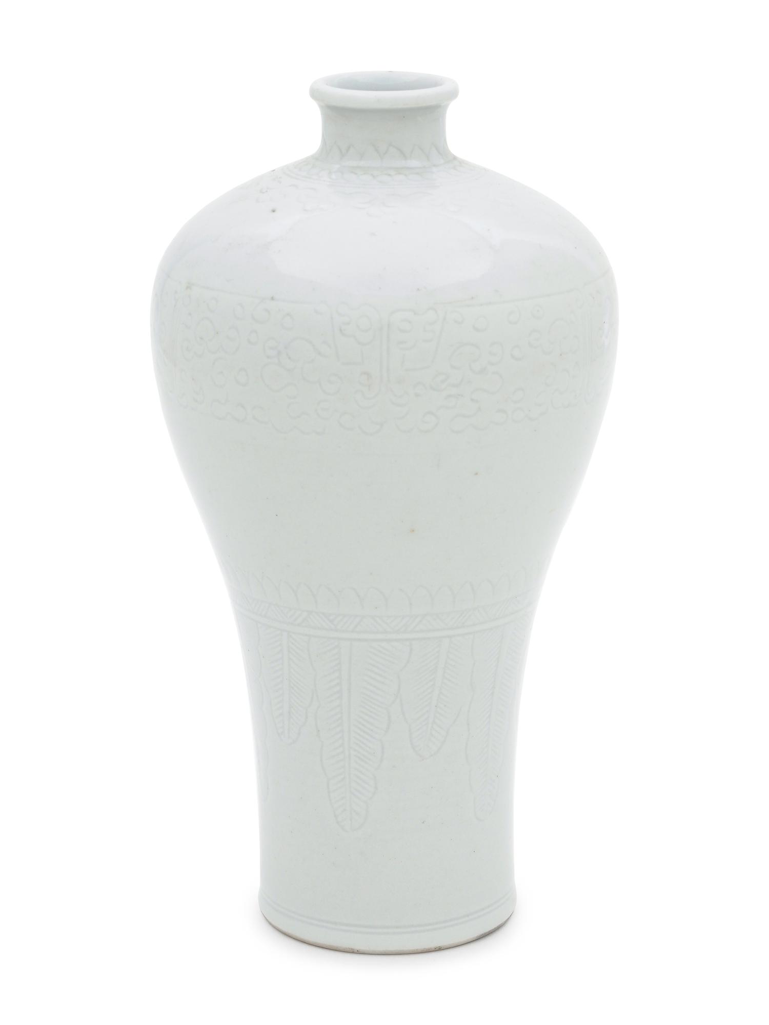 Two White Glazed Anhua Decorated Vases