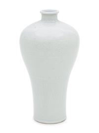 Two White Glazed Anhua Decorated Vases