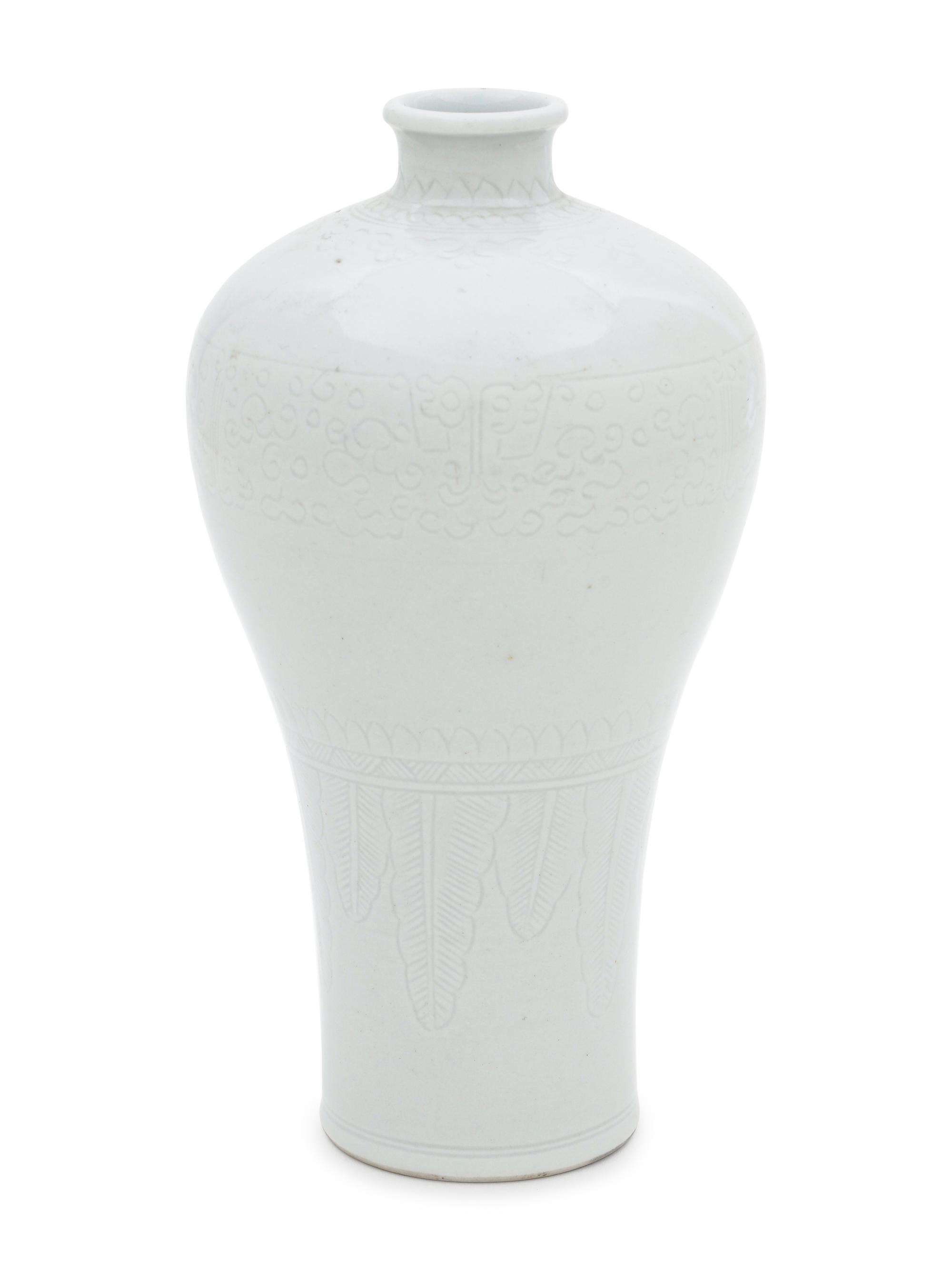 Two White Glazed Anhua Decorated Vases