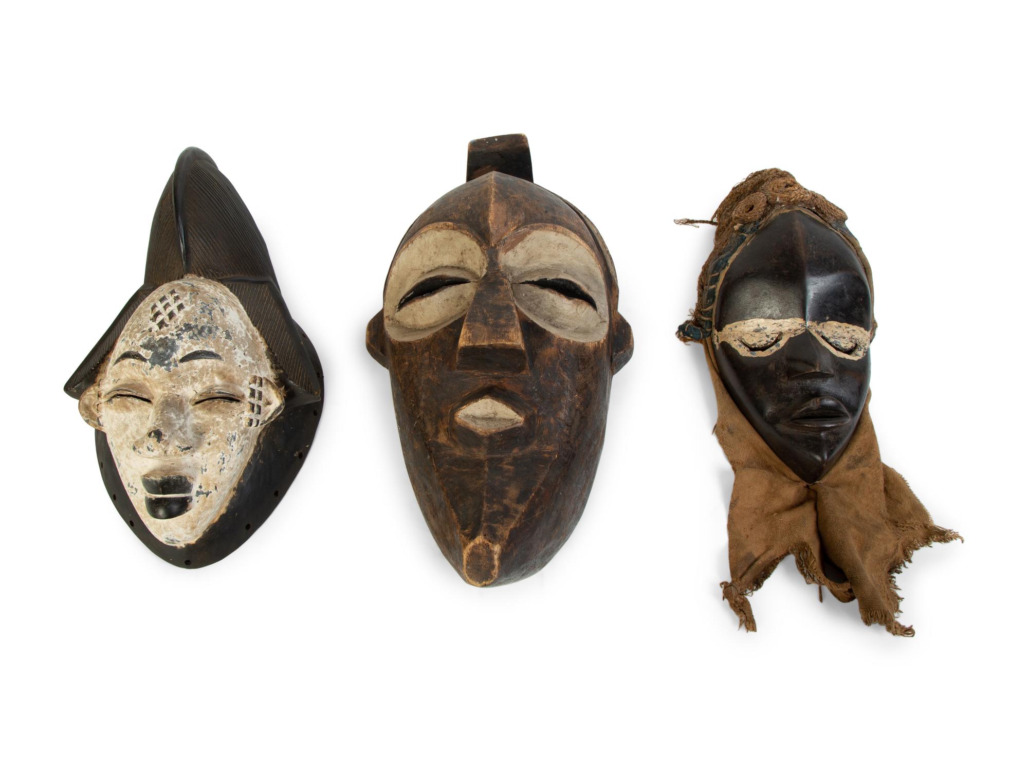 A Group of Three African Tribal Face Masks — 20TH CENTURY