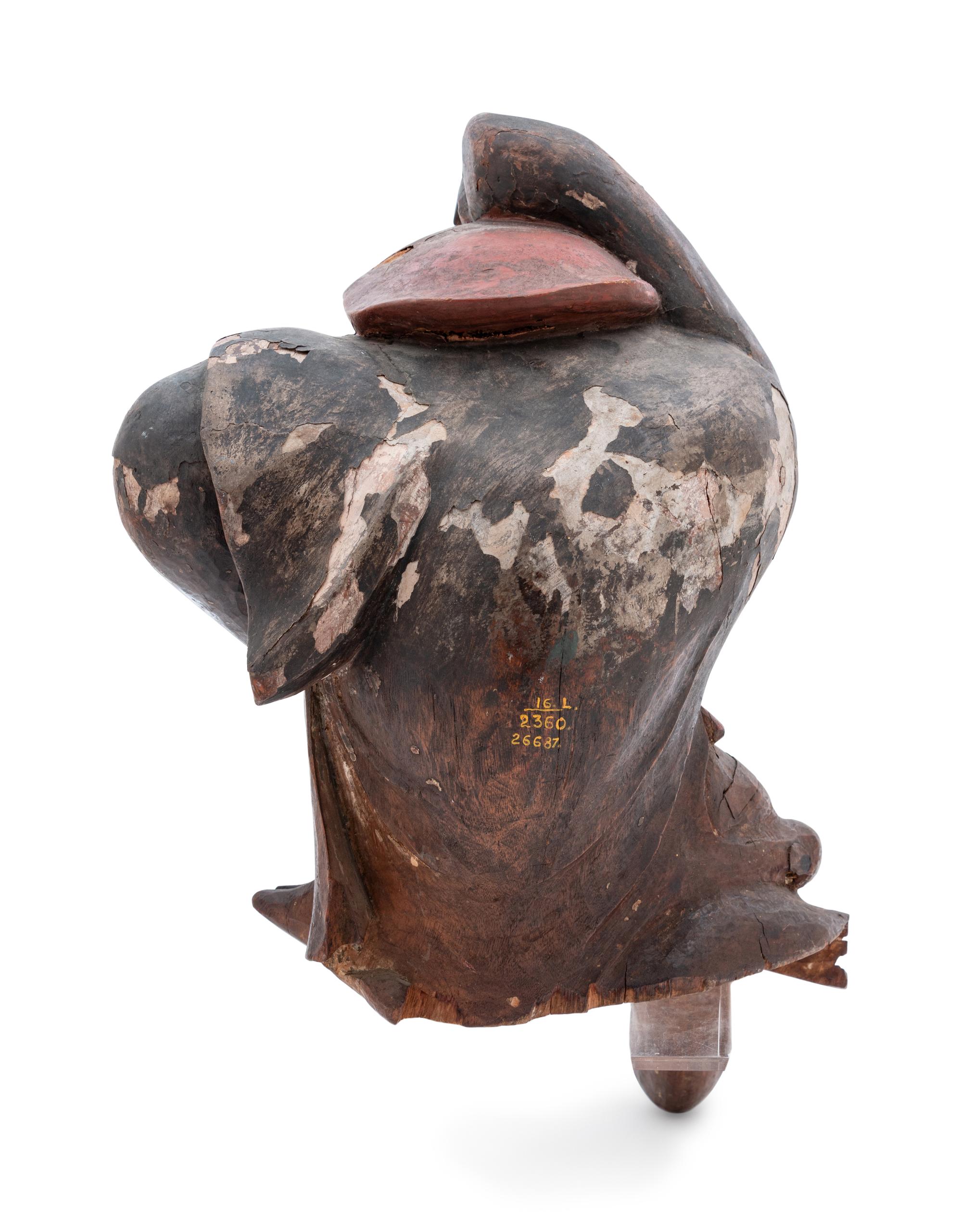A Carved Wood Figure of a Monkey