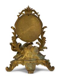 A Continental Rococo Style Gilt Metal Table Mirror