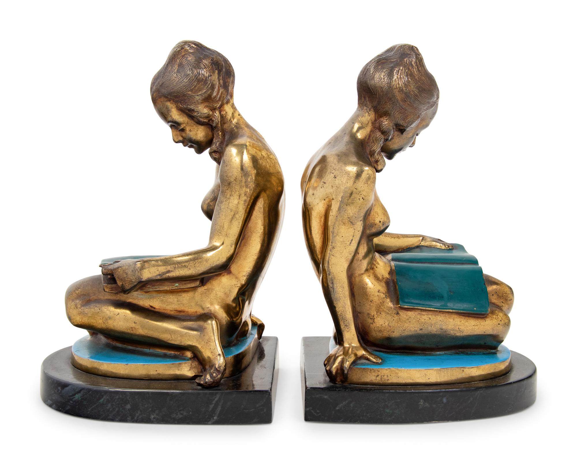 A Pair of Gilt Metal Figures of Seated Maidens