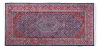 An Iranian Rug 9 feet 7 inches x 4 feet 10 1/2 inches.