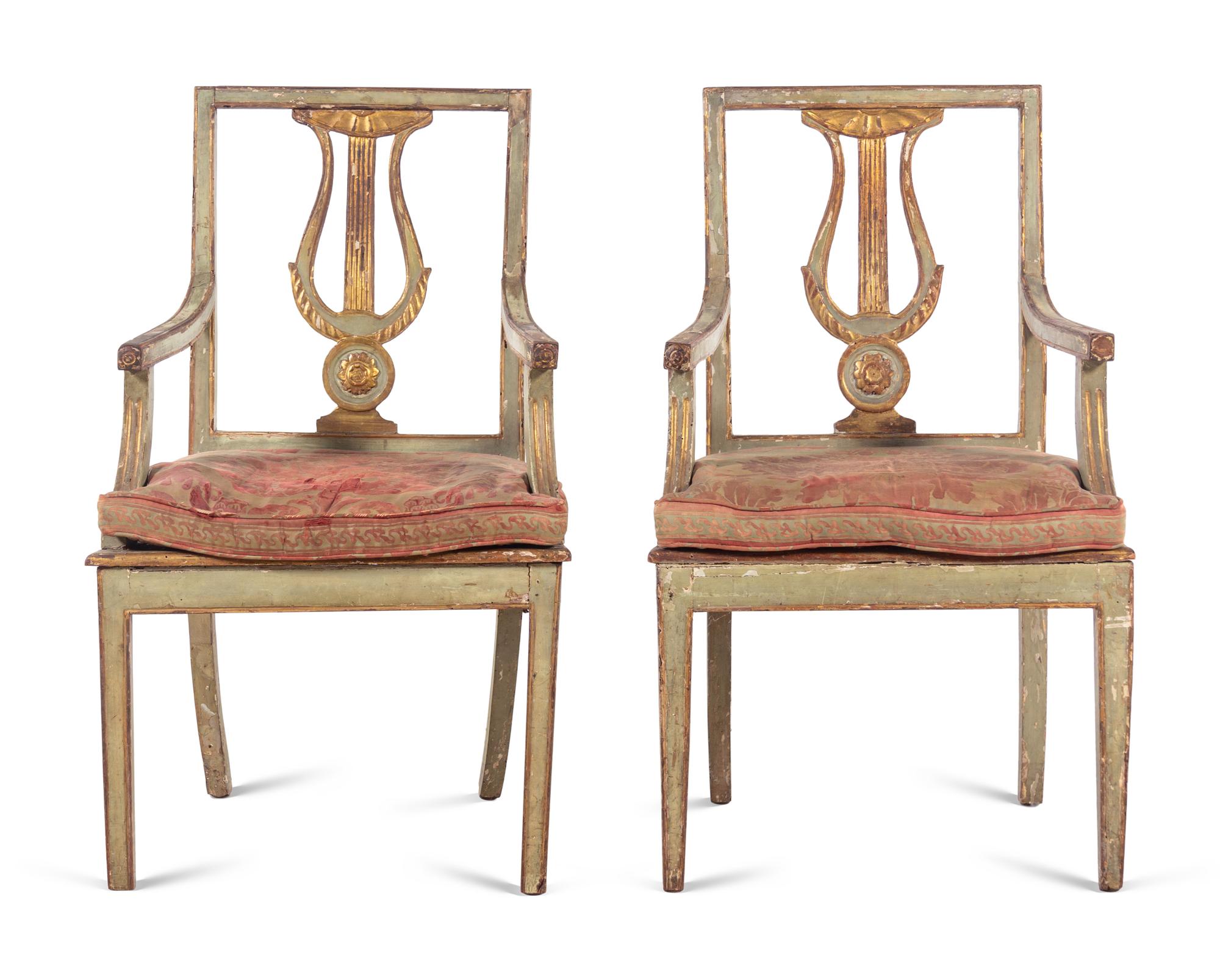 A Pair of Italian Painted and Parcel Gilt Lyre-Back Armchairs
