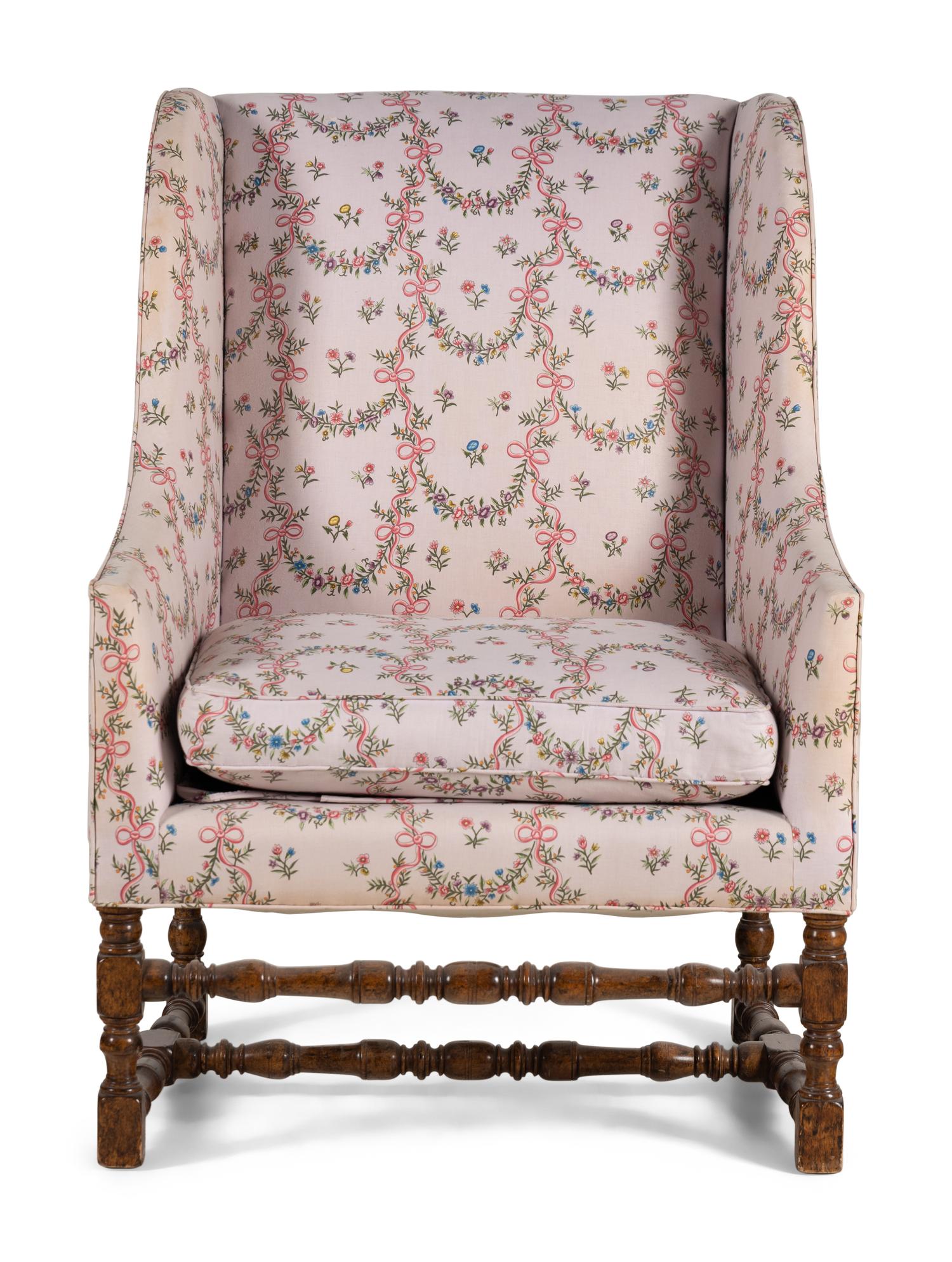 A Louis XIII Style Carved Armchair and Ottoman