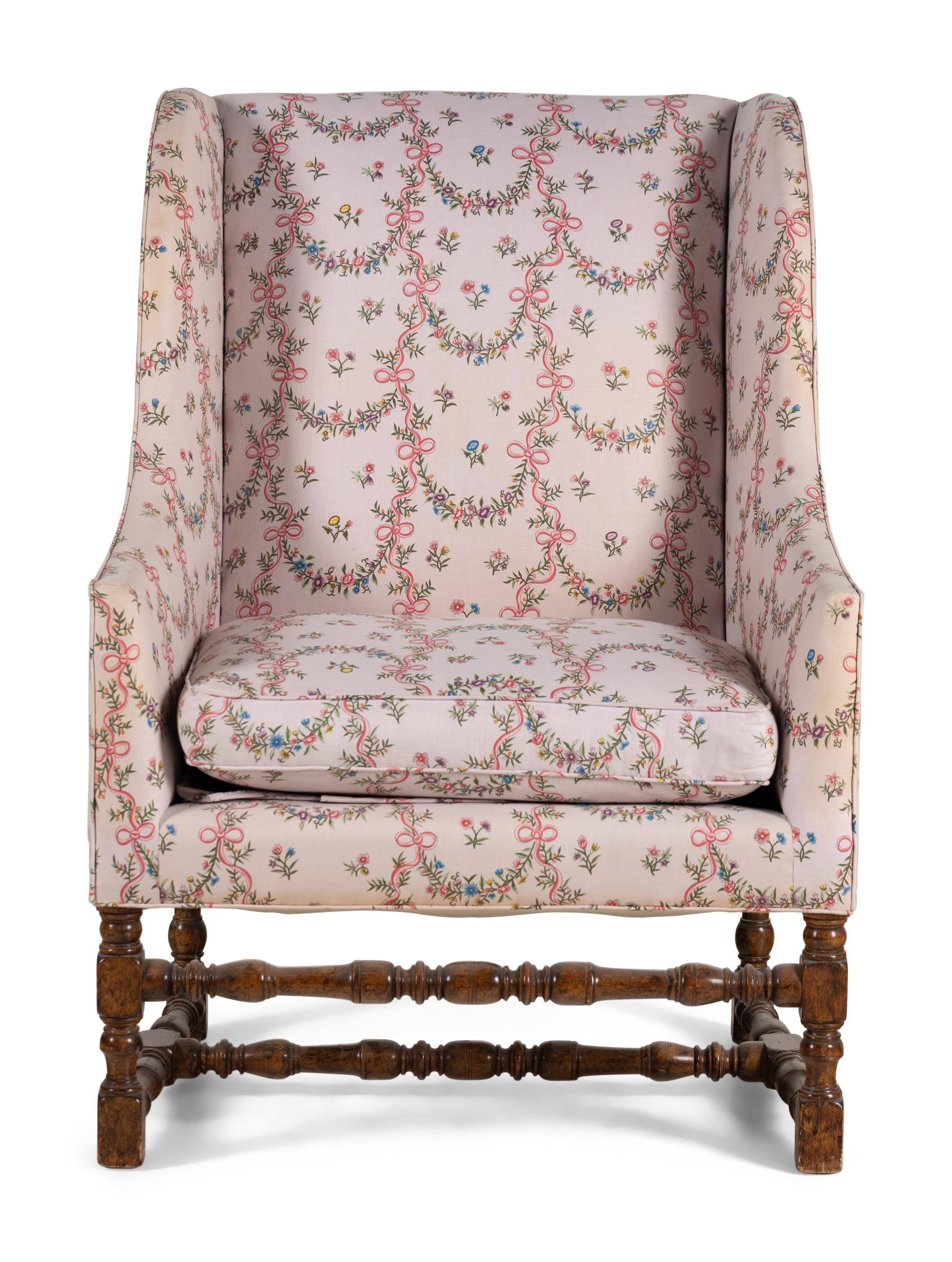 A Louis XIII Style Carved Armchair and Ottoman