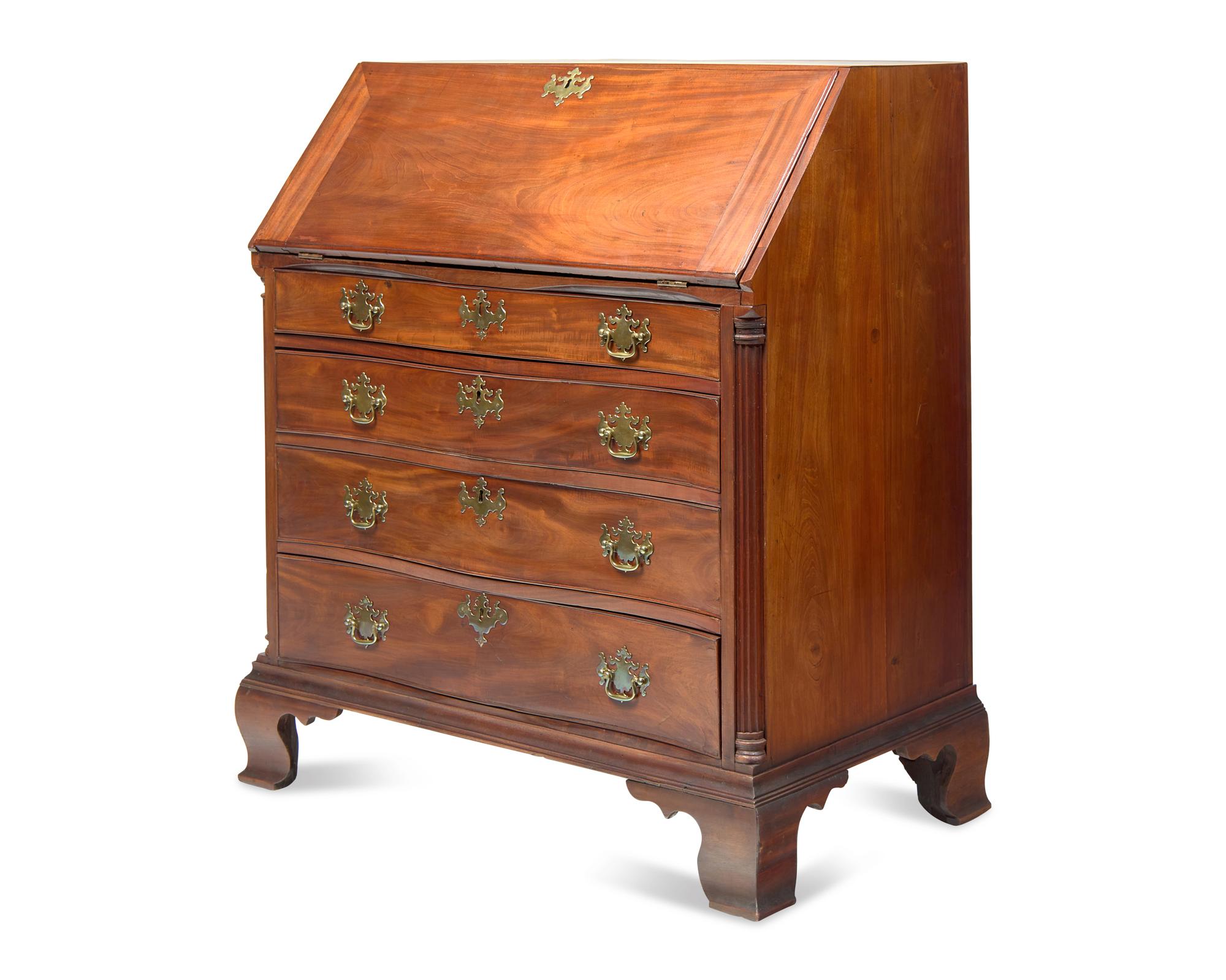 A Chippendale Carved Mahogany Serpentine-Front Slant-Front Desk