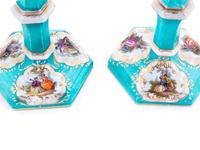 A Pair of Berlin (K.P.M.) Painted and Parcel Gilt Porcelain Candlesticks