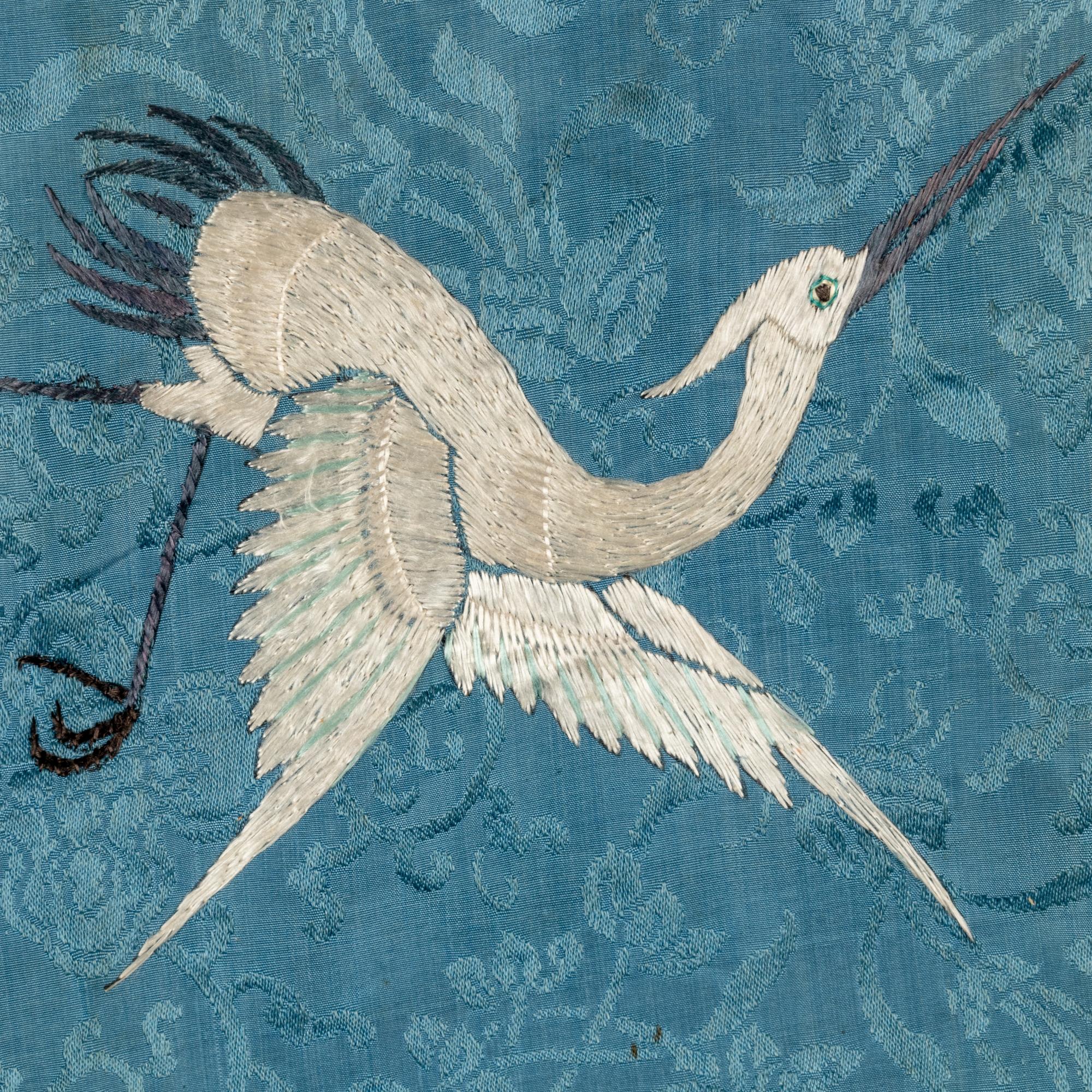 Two Chinese Embroidered Silk Lady's Robes, 19th Century 清晚期 藍地織錦綉花女上衣兩件