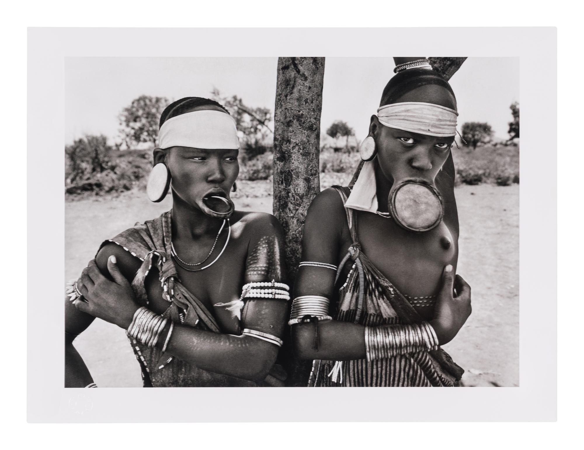 Genesis: Art Edition, Taschen, Paris 2013 (SUMO in two volumes together with booklet, varnished cherry wood lectern designed by Tadao Ando, and signed gelatin silver print Two Mursi Women, Omo Valley, Ethiopia )