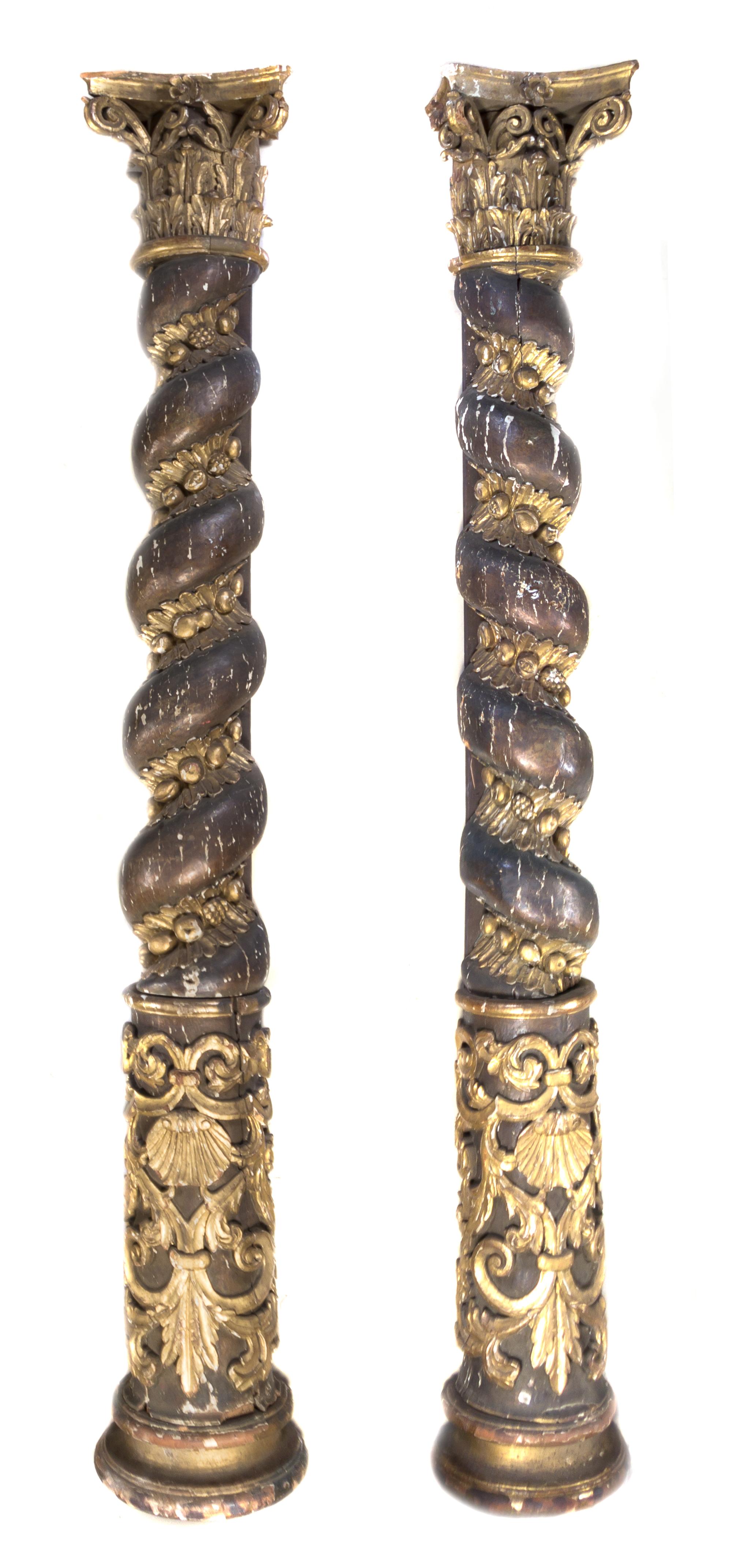 A Pair of Continental Painted and Parcel Gilt Solomonic Columns, Height 124 inches.