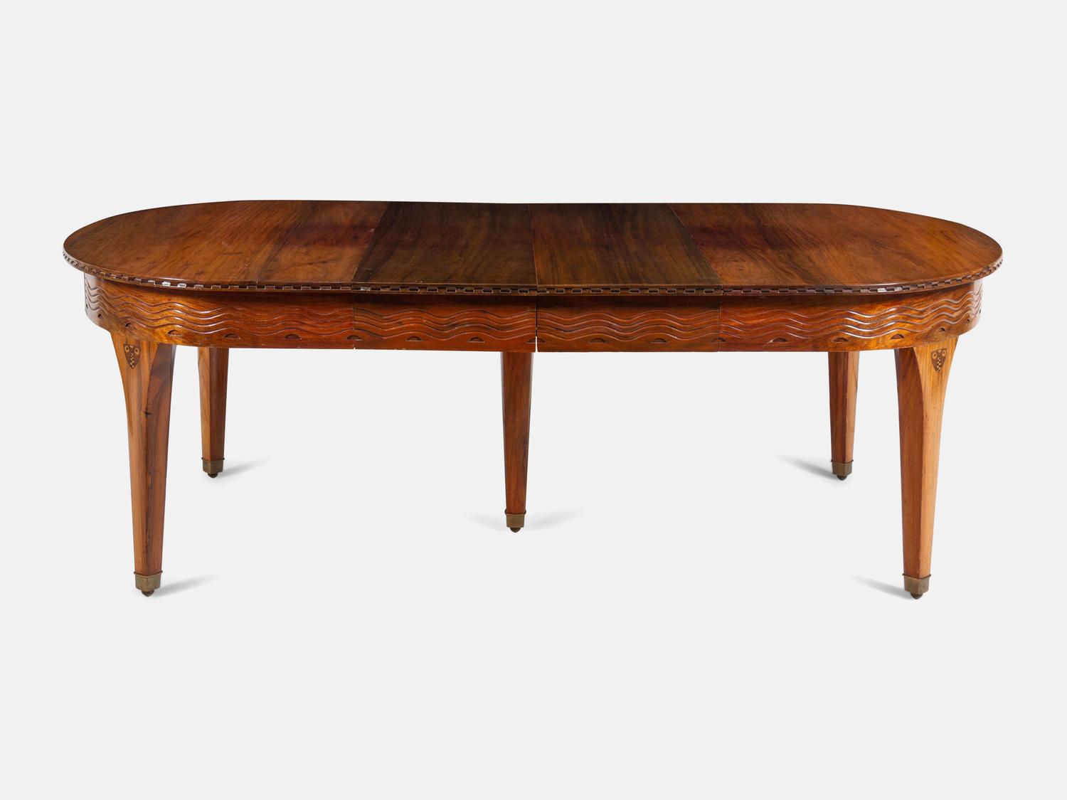 An Austrian Secessionist Inlaid Dining Suite, comprising a sideboard, a server, an extension dining table with five leaves, six side chairs and four armchairs