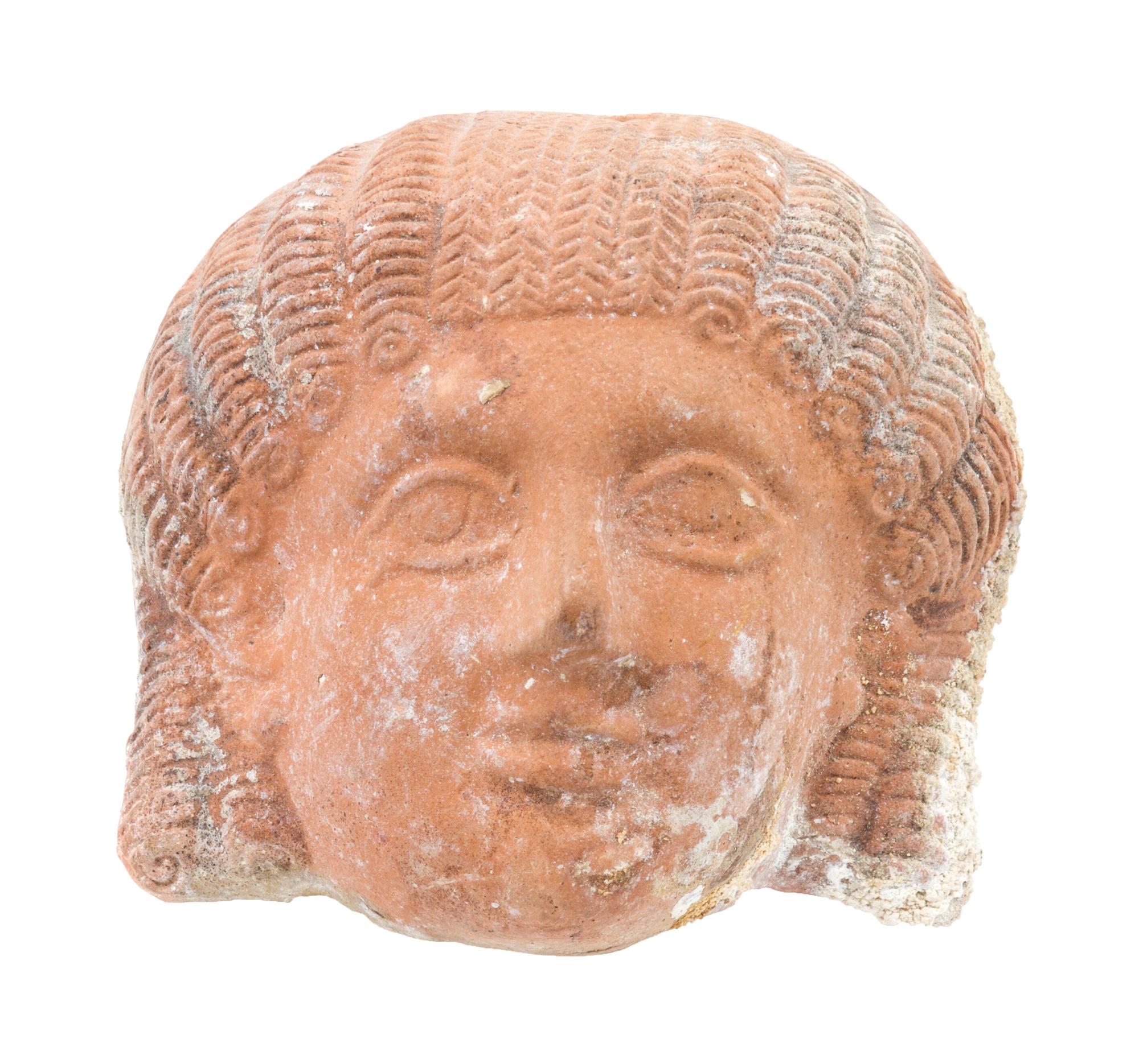 A Phoenician Terra Cotta Mask Height 4 x width 4 1/2 inches. — PROBABLY SEVENTH/EIGHTH CENTURY B.C.