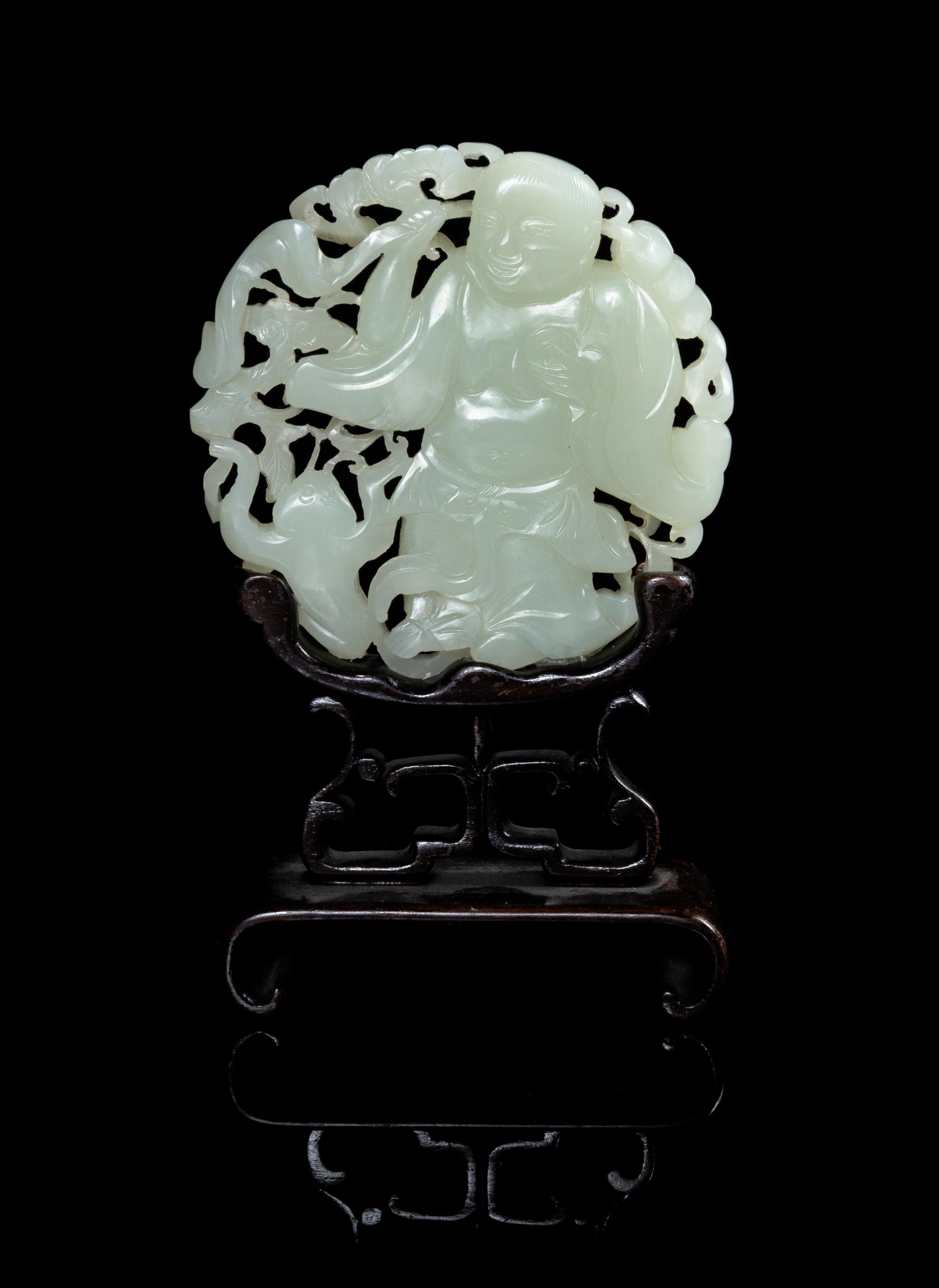 A Carved Celadon Jade Circular Plaque Diameter 3 1/4 inches. — 19TH CENTURY