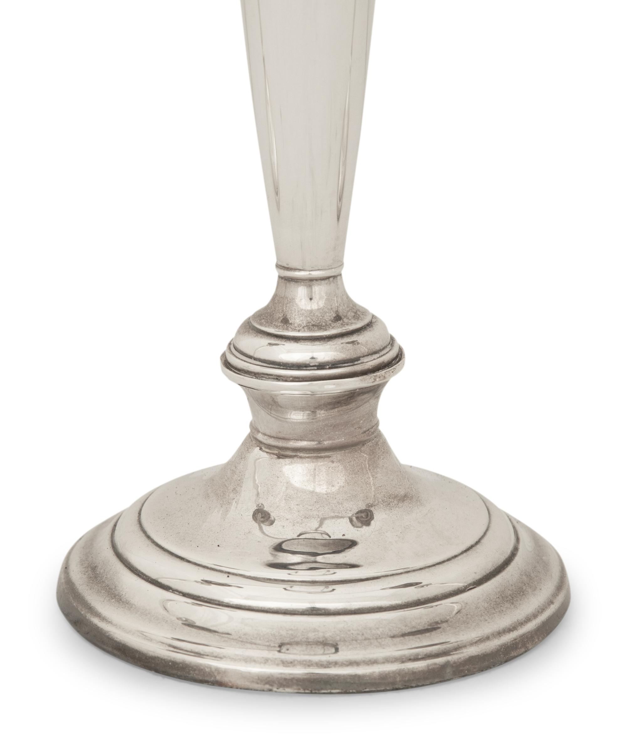 A Pair of American Silver Candlesticks and an American Silver Three Light Candelabrum