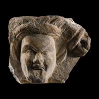 A Roman Marble Relief Fragment with the Head of a Satyr