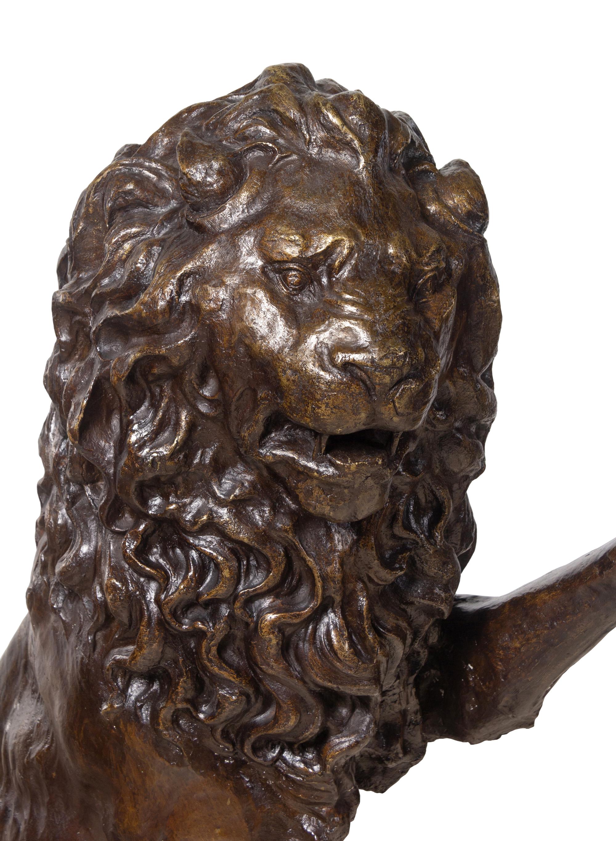 A Pair of Patinated Bronze Lions