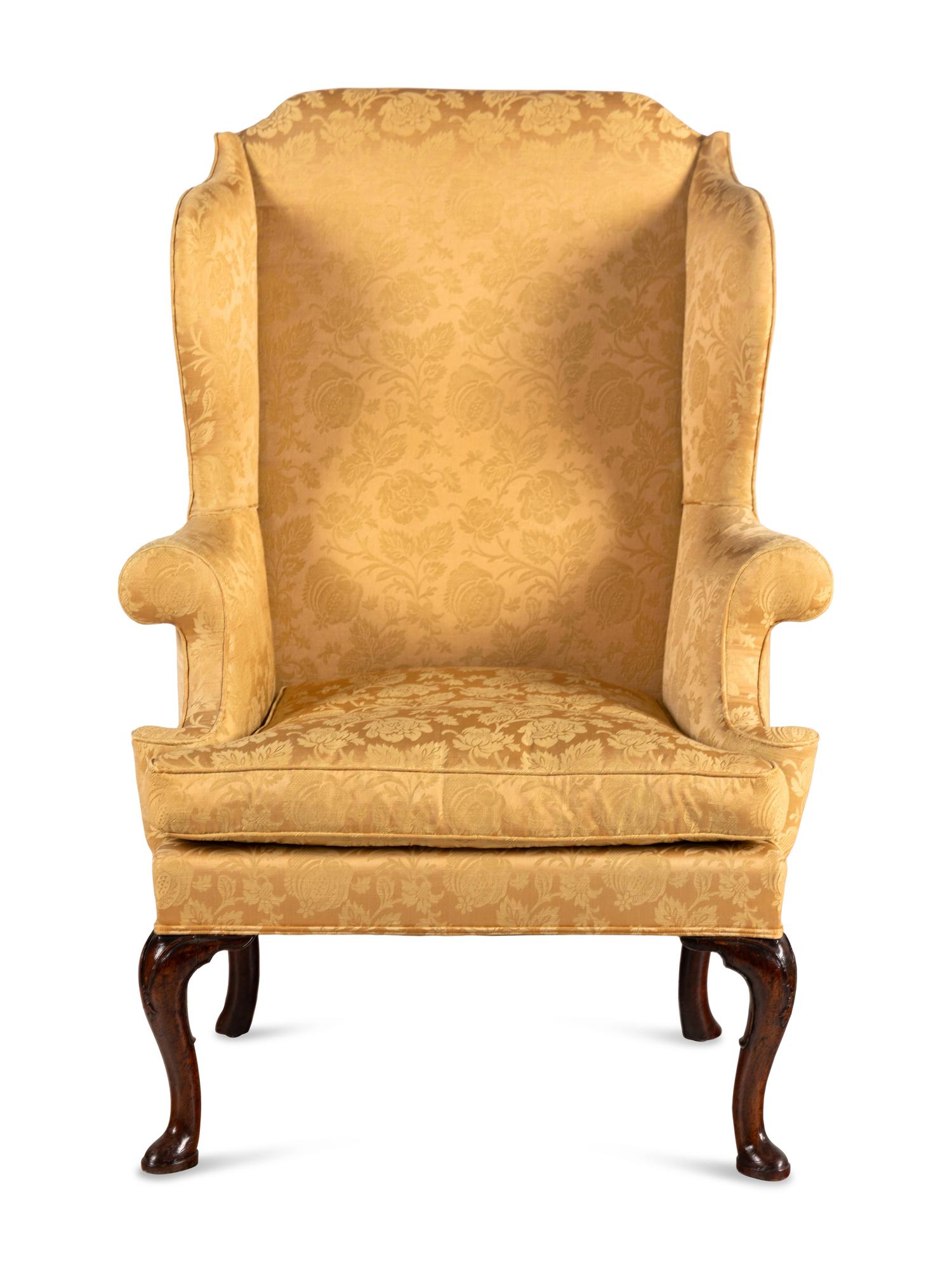 A George I Walnut Wingback Armchair