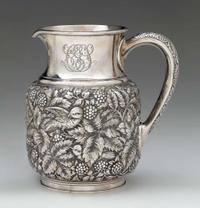 A fine sterling silver repoussé water pitcher thomas f. brogan (active 1896-1930), new york, ny, retailed by theodore b. starr