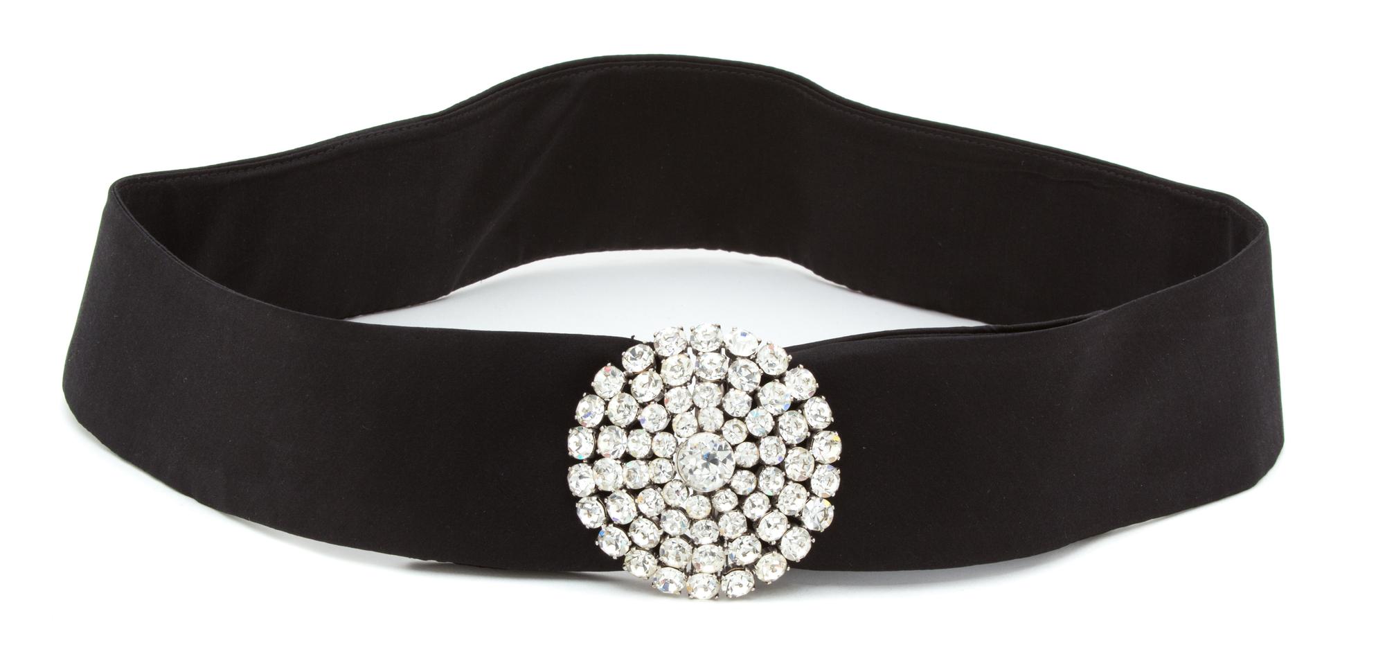 A Rhinestone and Silvertone Evening Belt, Belt: 35.5" - 37" x 2.5"; Buckle: 3" diameter.